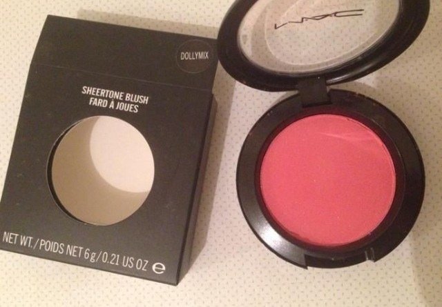 Warming jelly blush product between fingertips in jelly blush makeup tutorial