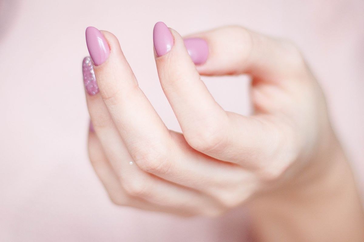 Almond shaped jelly pink chrome nails with iridescent glow