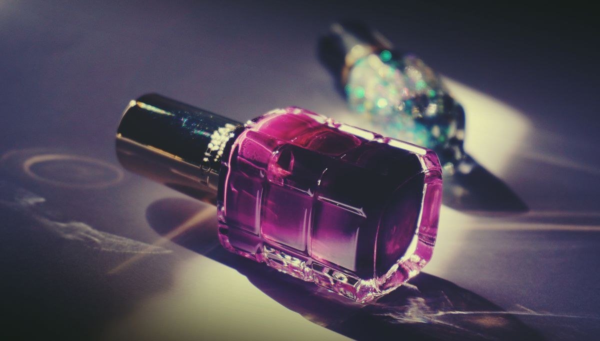 Jelly pink chrome nails styled with fashionable outfit and accessories