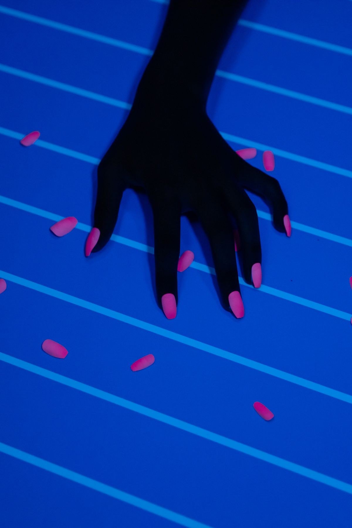 Hot pink chrome nails with bold mirror-bright reflective finish