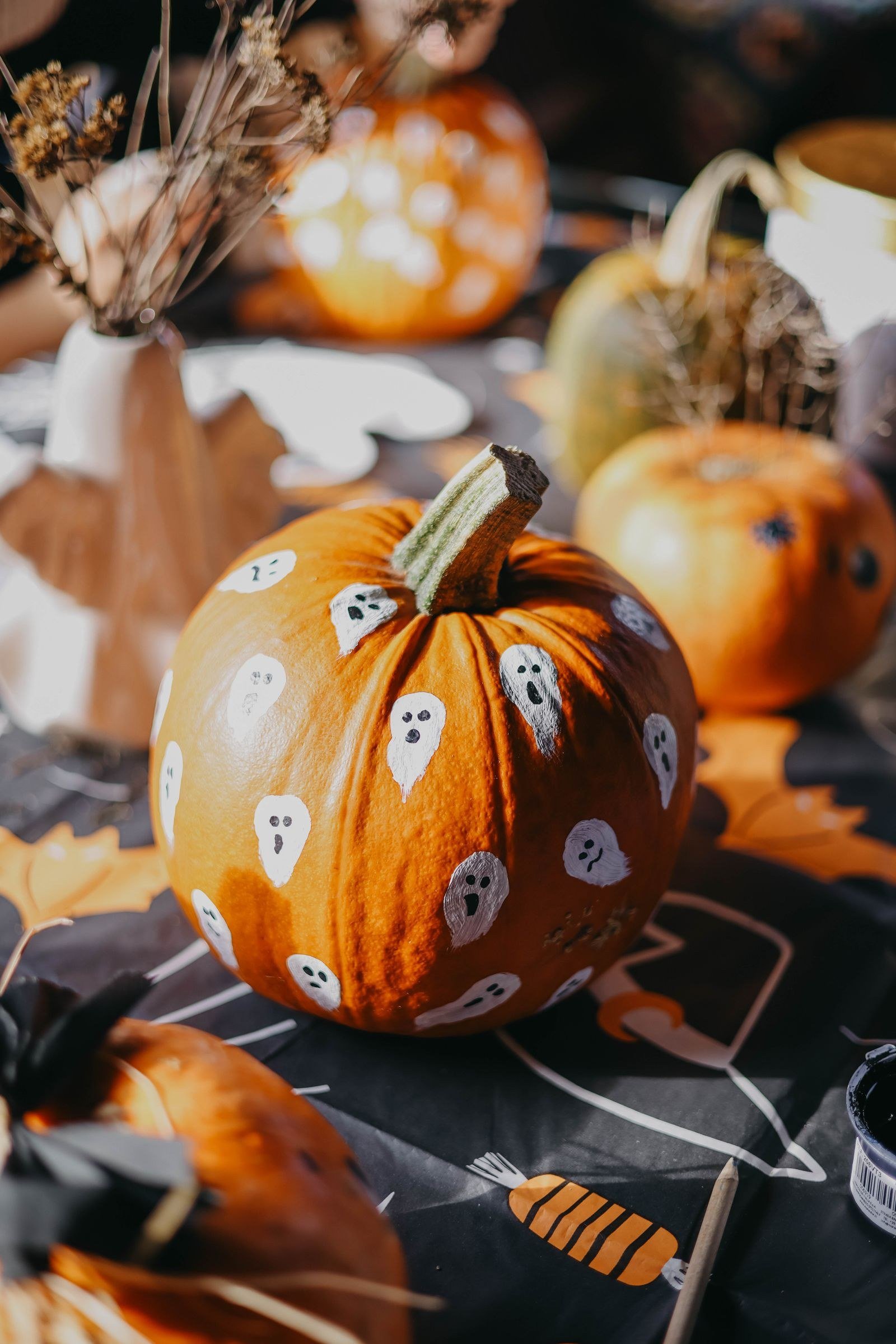 Glow-in-the-Dark Ghost Designs for Ghost face pumpkin painting ideas