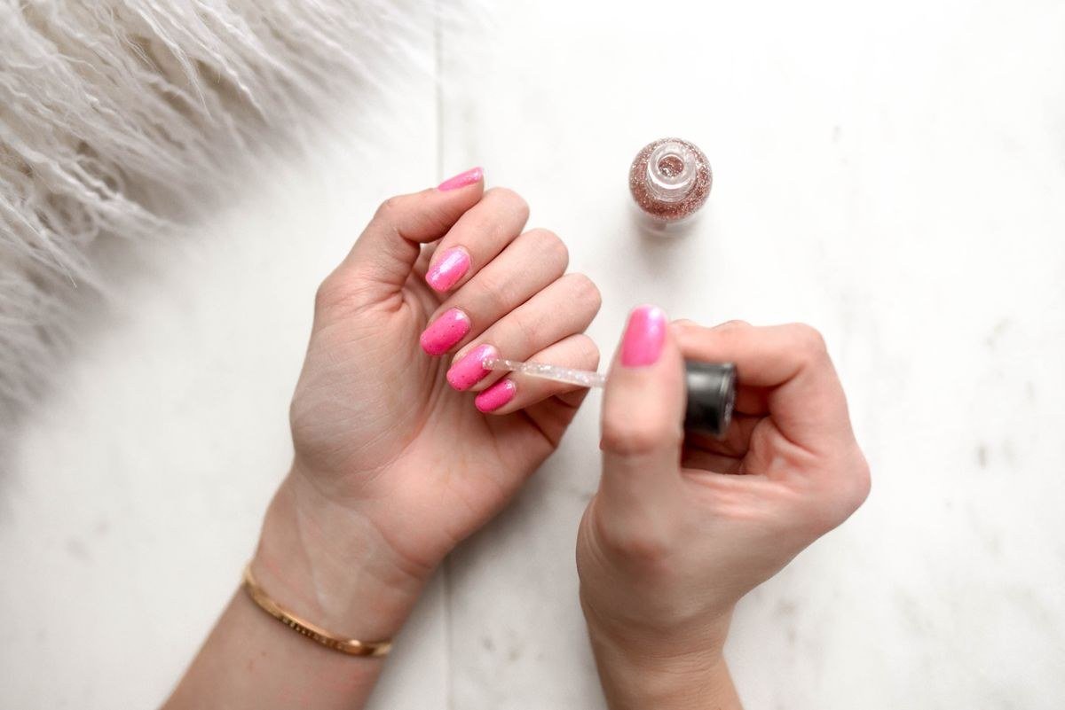 Hot pink chrome French tip nails with nude base