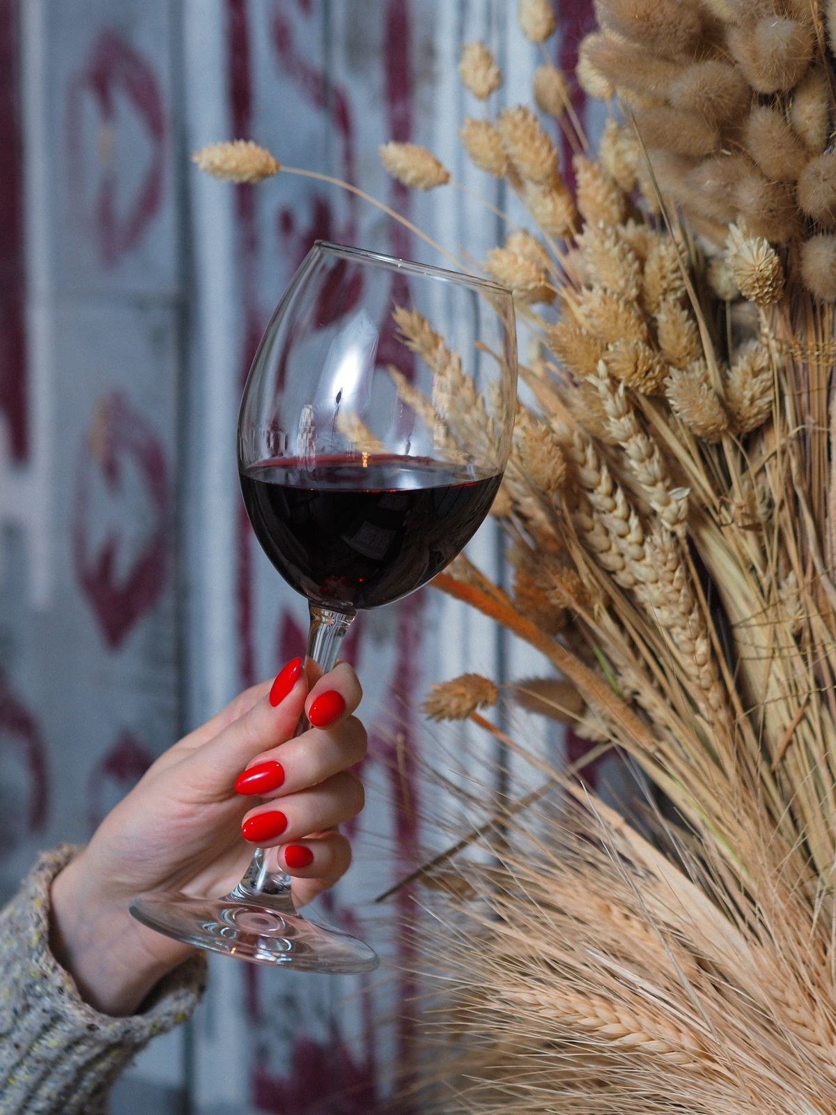 Diagonal off-center cat eye stripes on dark red nails