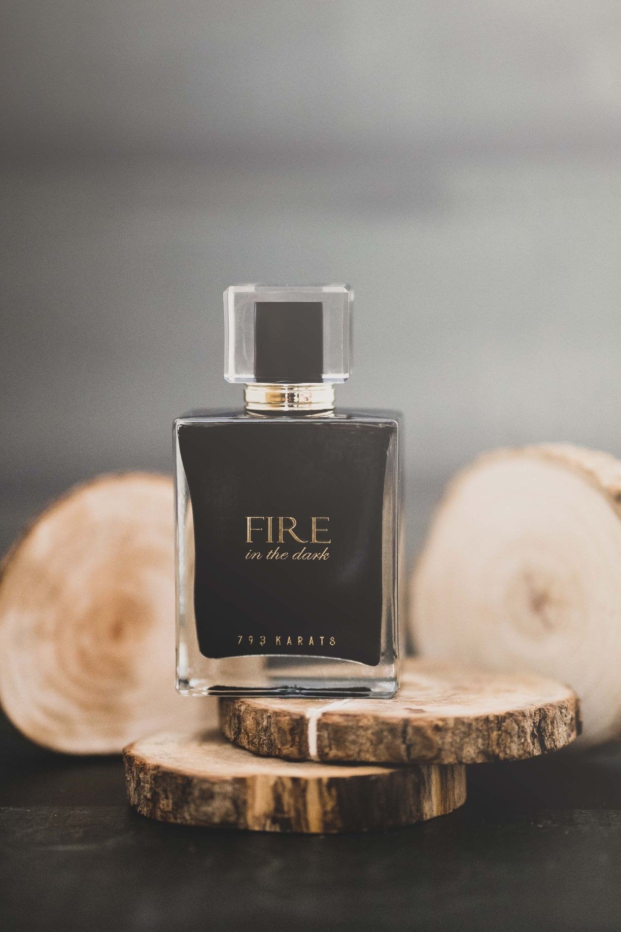 Luxurious perfume bottle displayed on rustic wood, exuding elegance
