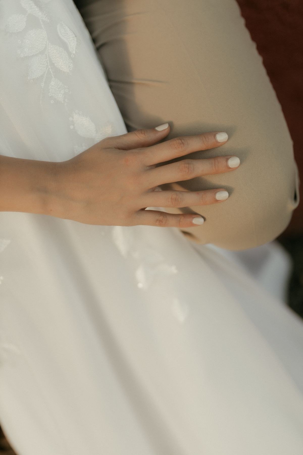 Classic glossy caramel nude manicure with high shine finish