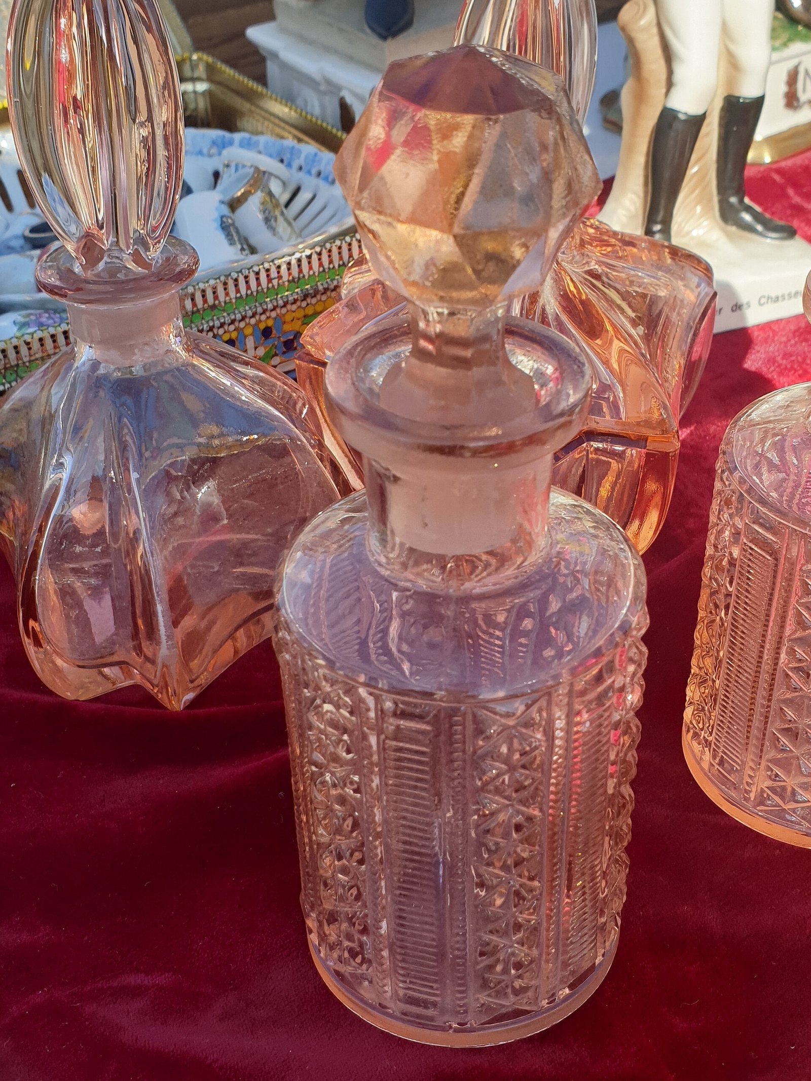 Elegant perfume bar setup at a wedding reception with glass bottles