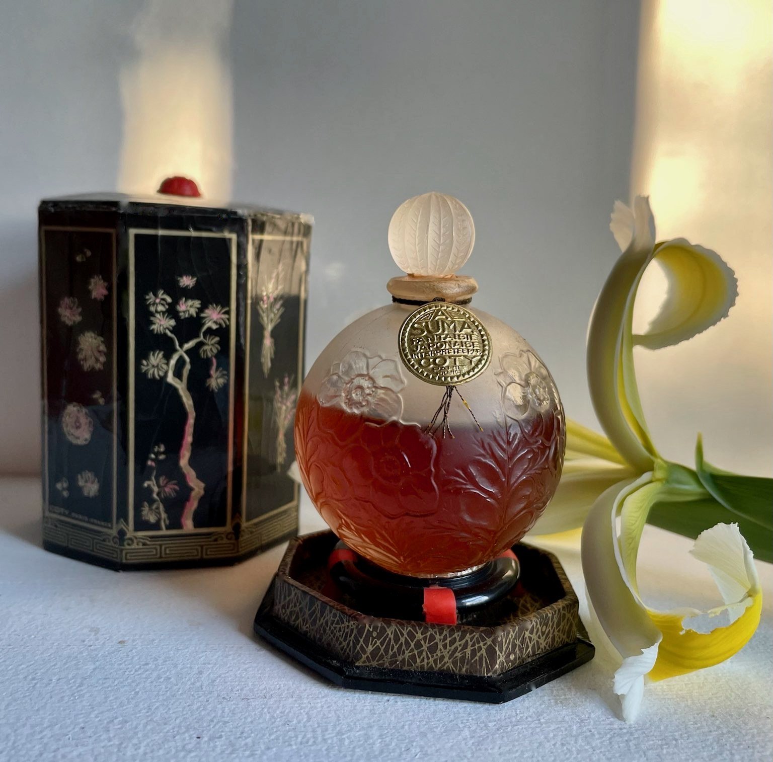 Beautifully styled perfume bar with flowers becoming a wedding focal point