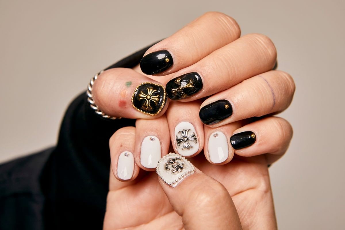 Classic black chrome manicure on almond shaped nails