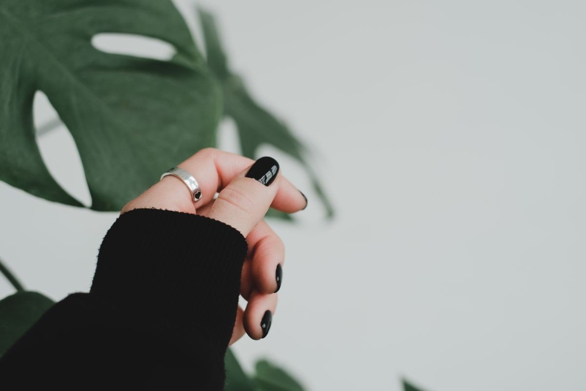 Matte black nails with shiny chrome accent details