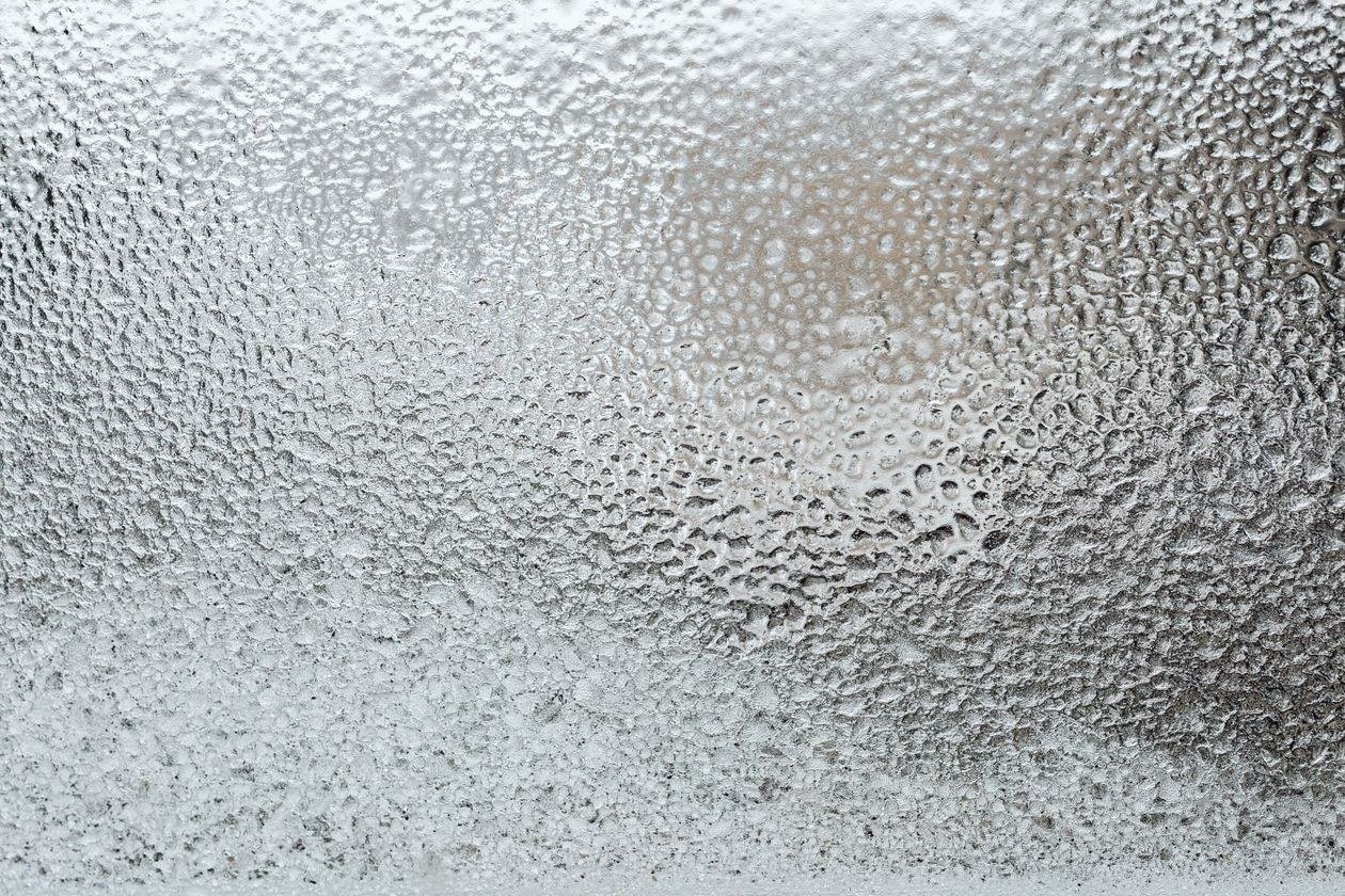 A detailed view of a frosted glass surface, capturing the icy texture and winter ambiance
