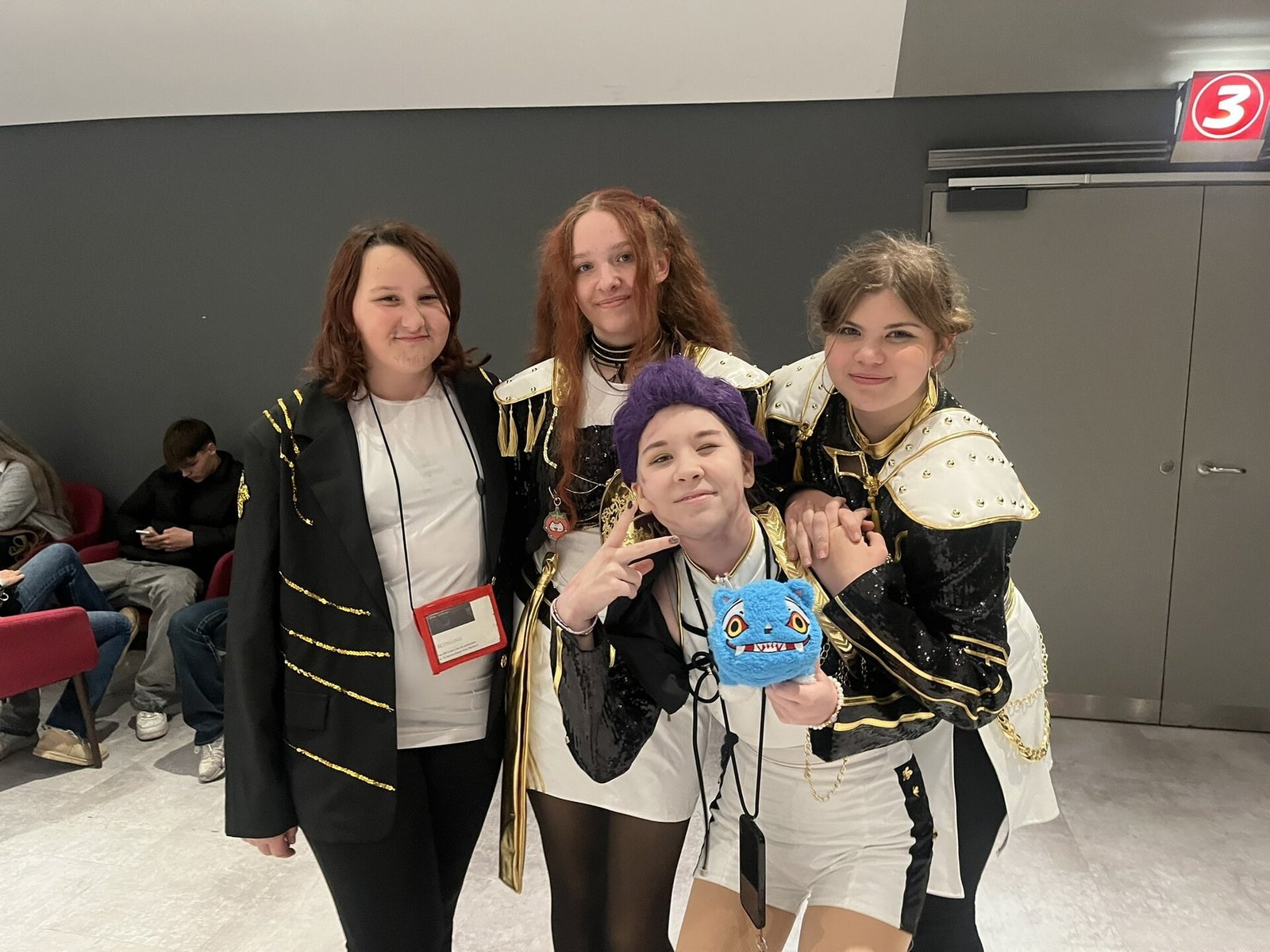 Halloween partygoers posing in KPop Demon Hunters inspired outfits