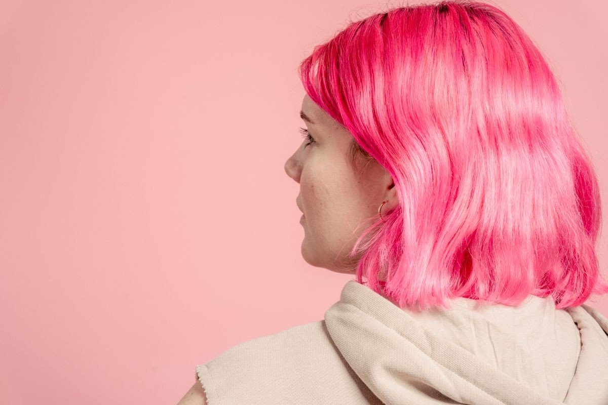 Dusty rose balayage blending into dark hair