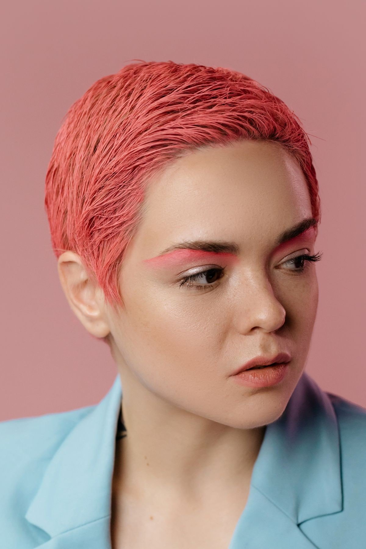 All over dusty rose pink hair colour from roots to ends