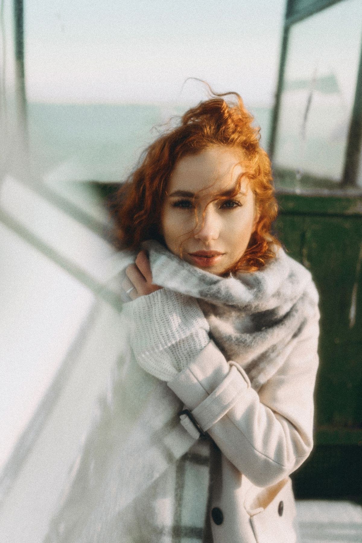 Curly soft copper blonde hair with dimensional warm tones