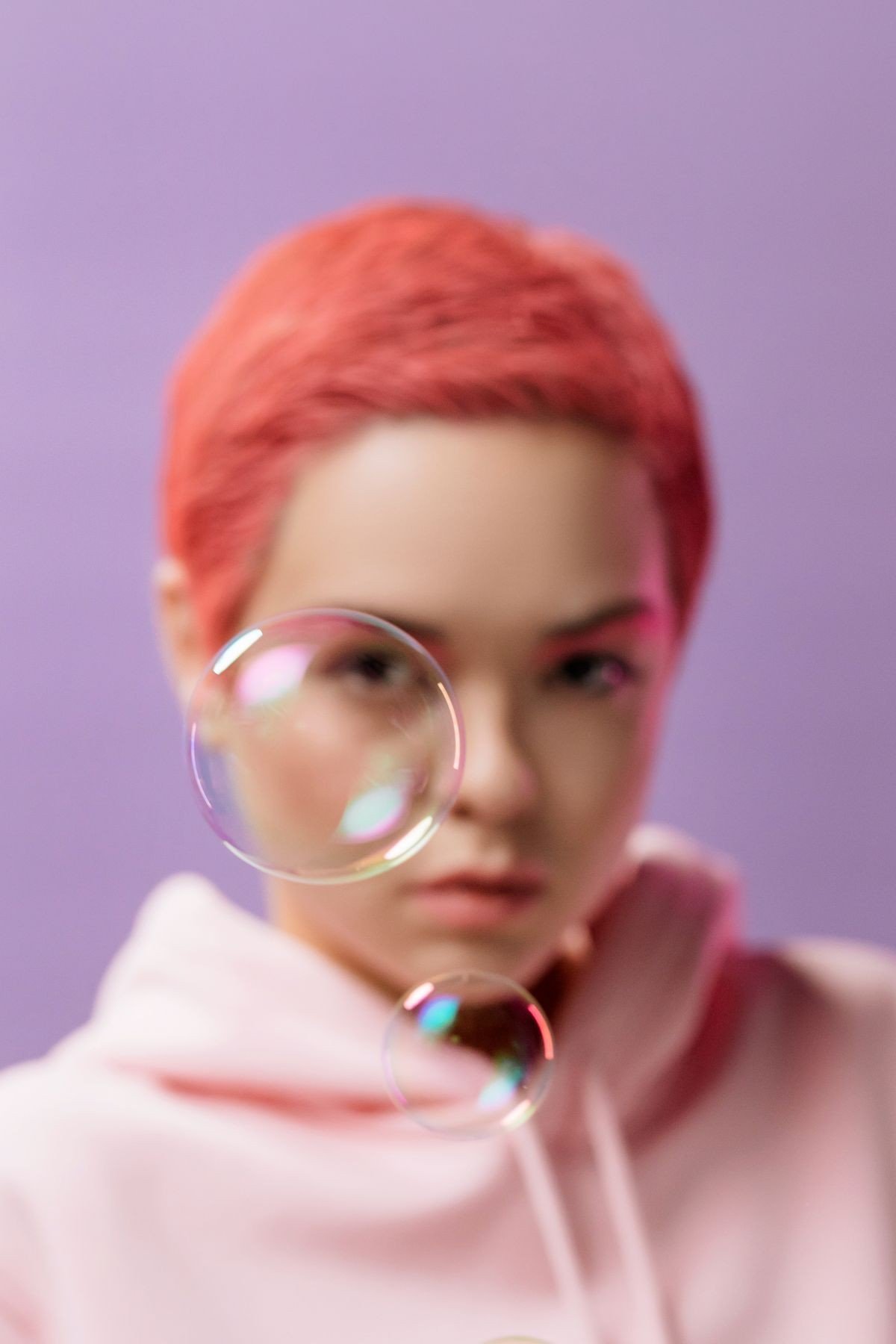 Dusty rose pink hair styled neatly for professional work