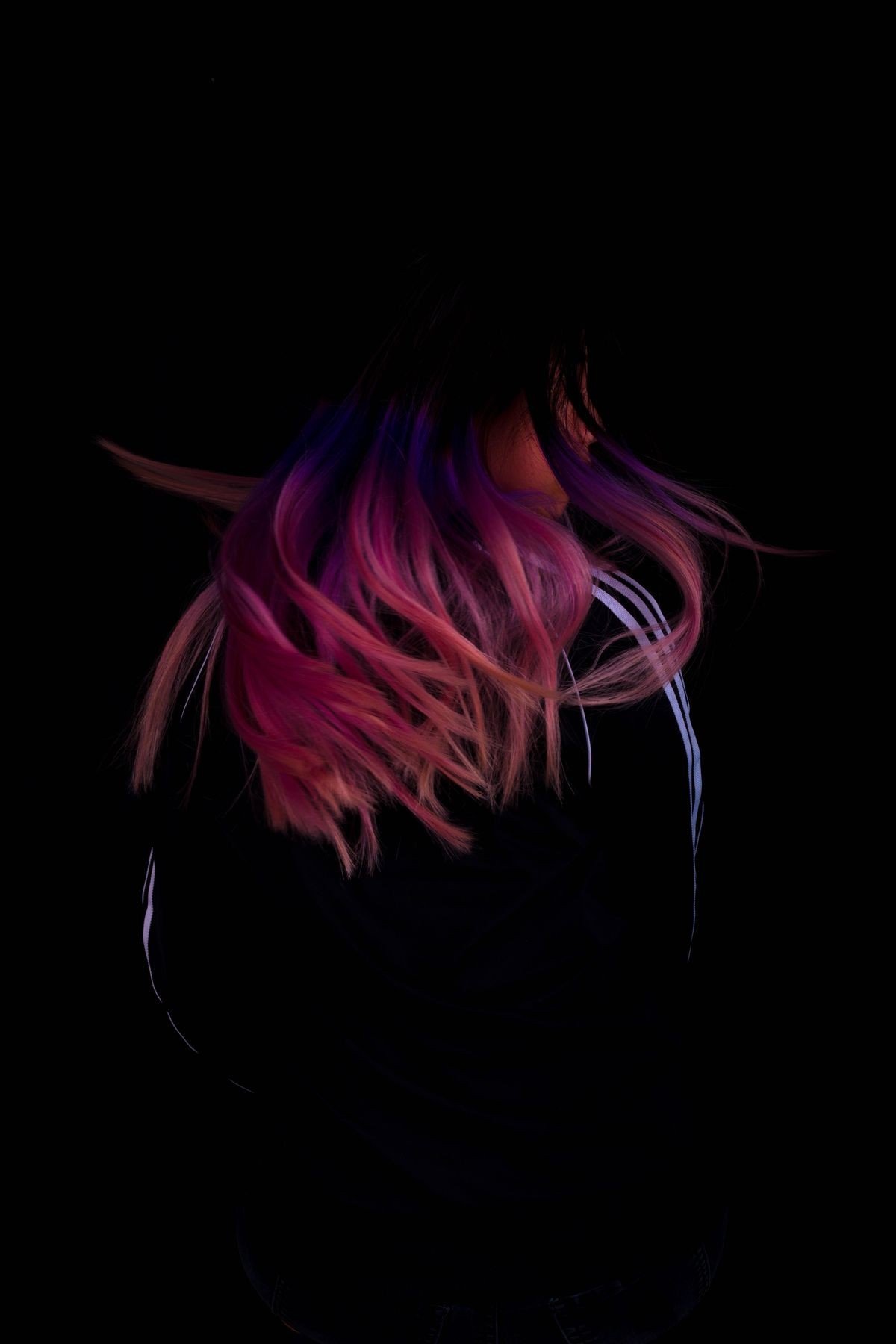 Face framing pink streaks highlighting the face