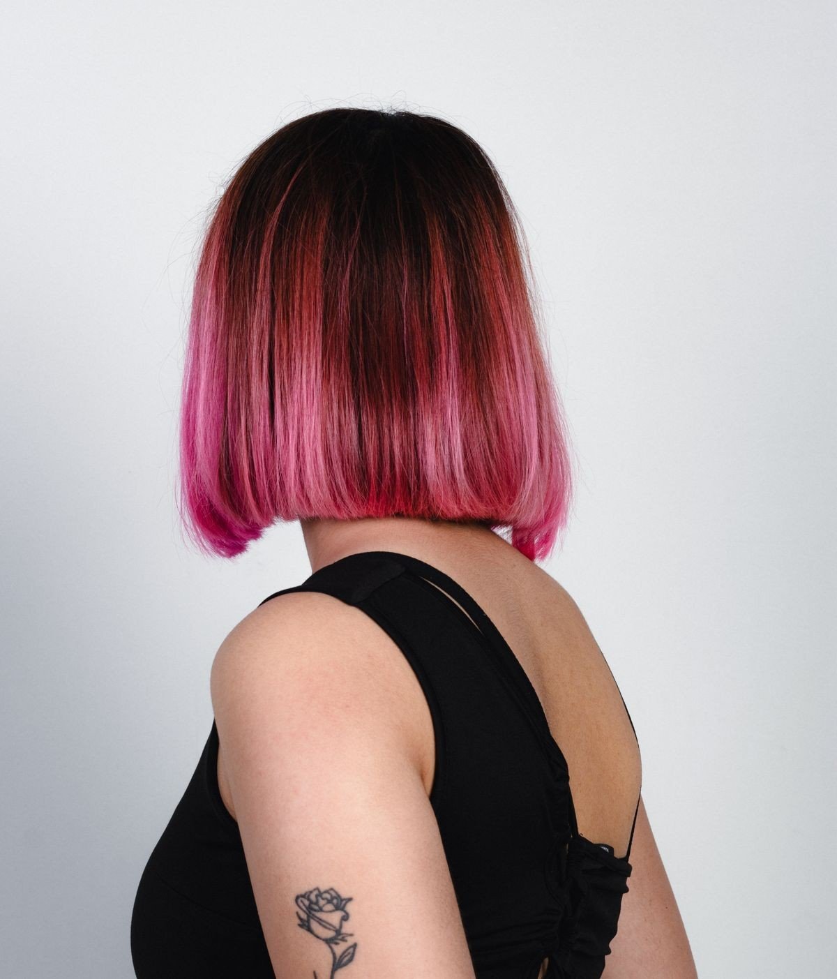 Peekaboo pink streaks hidden underneath top hair layers