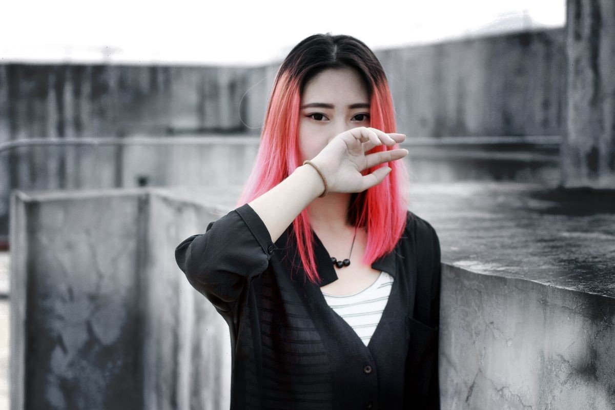 Pink streaks contrasting with dark brown hair