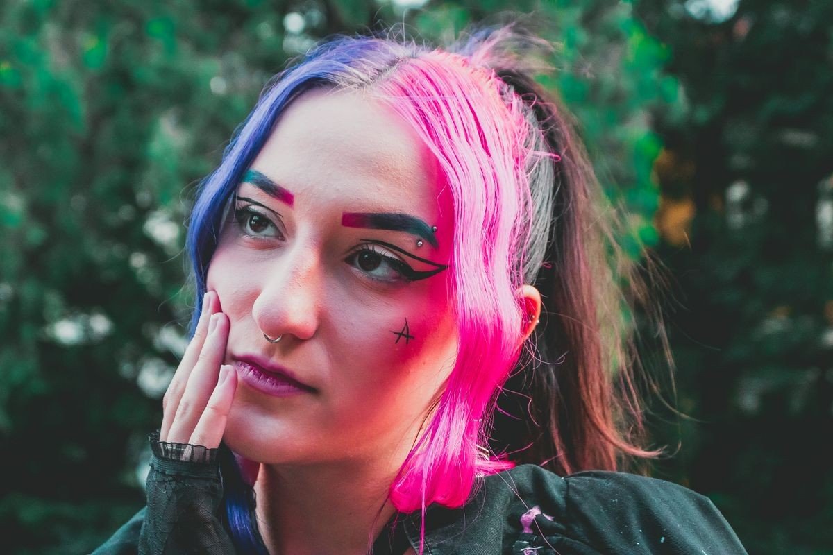 Pink streaks standing out against black hair