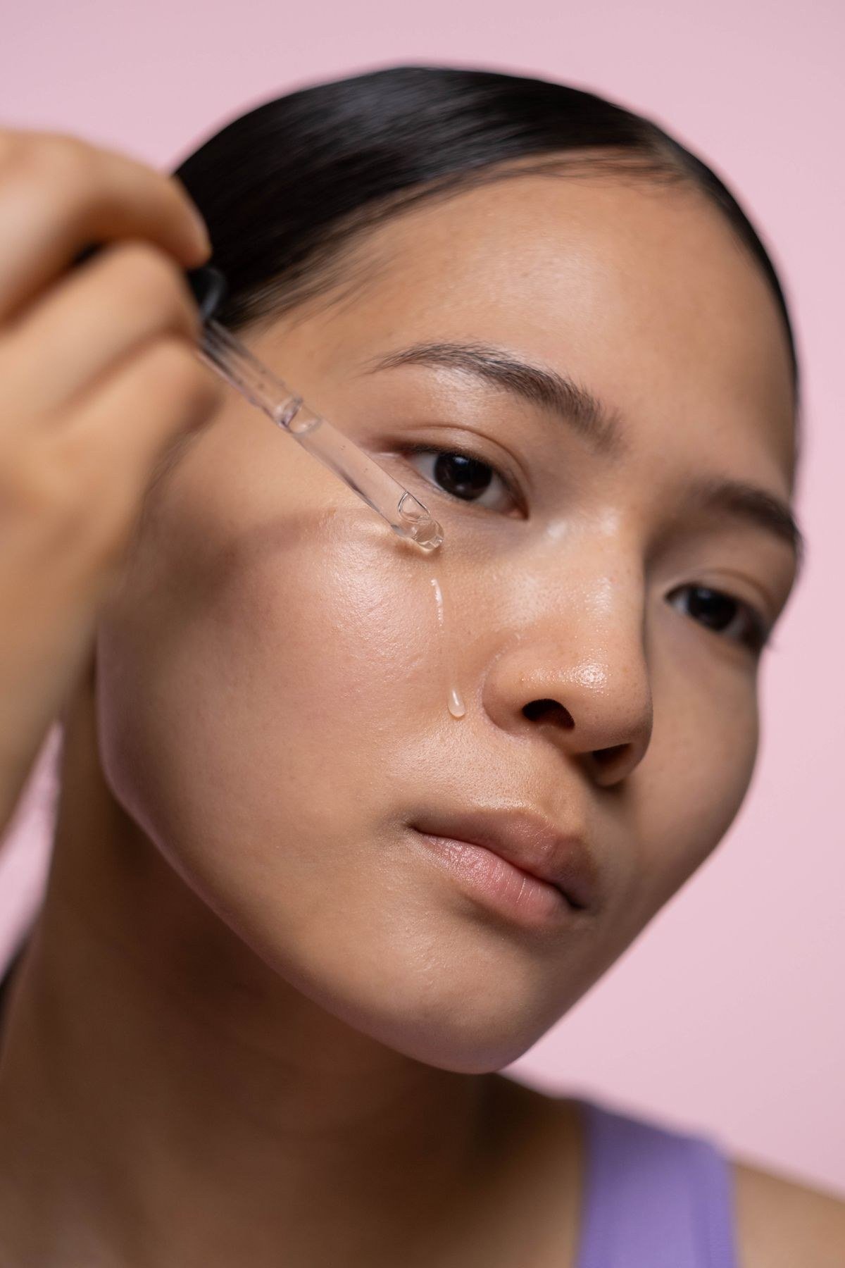 Subtle highlighter application on cheekbones for soft glow
