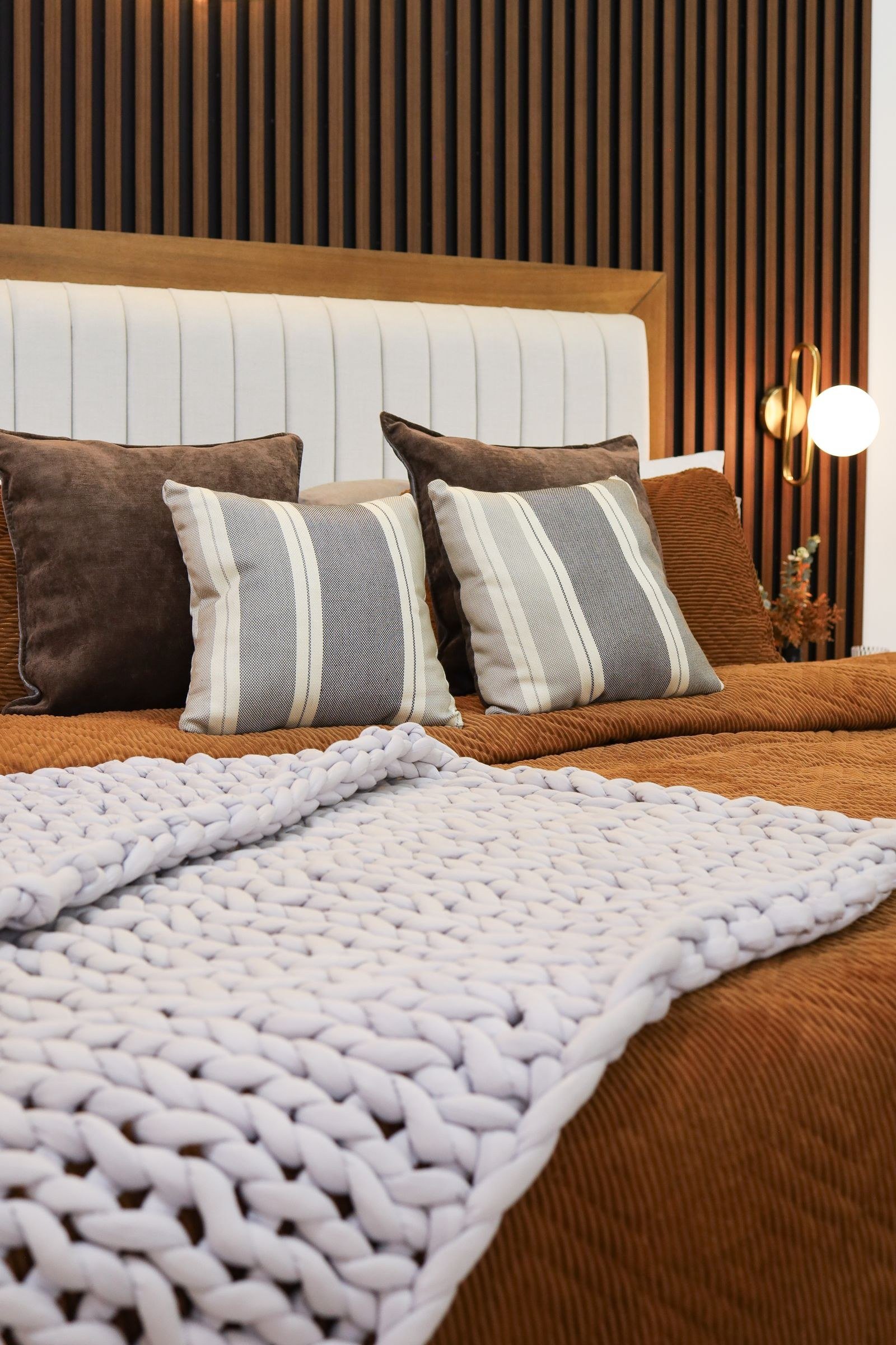 warm brown bedroom decor ideas — 11. Rugs to Anchor the Space