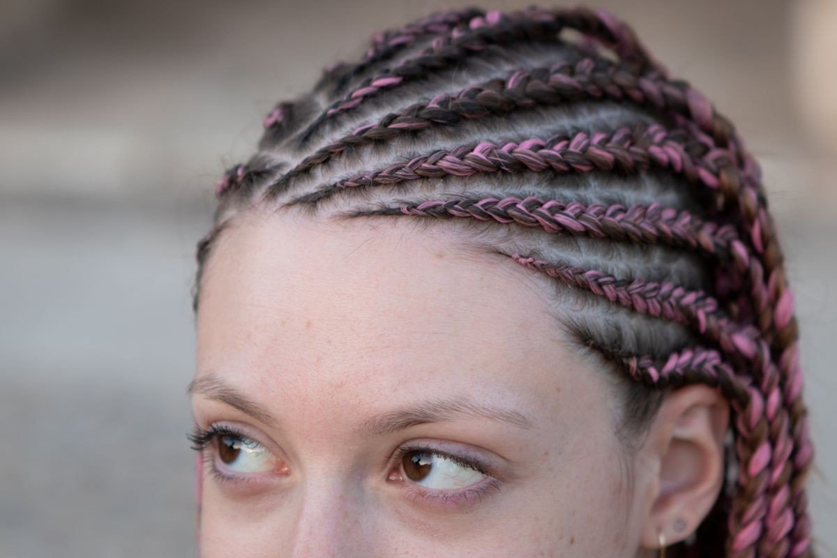 Long hair with pink dye streaks flowing through lengths