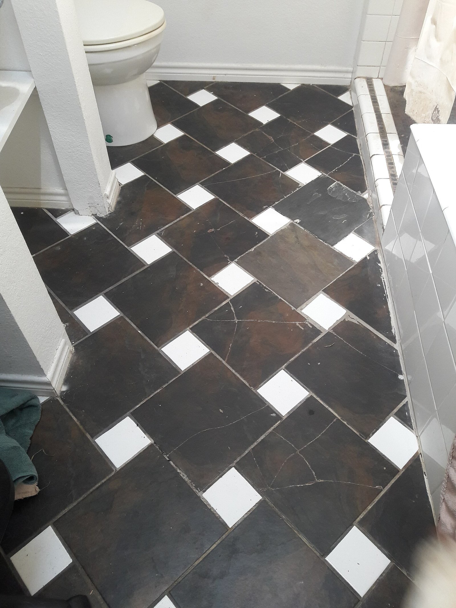 Statement tile bathroom ideas with bold patterned floor-to-ceiling tile design