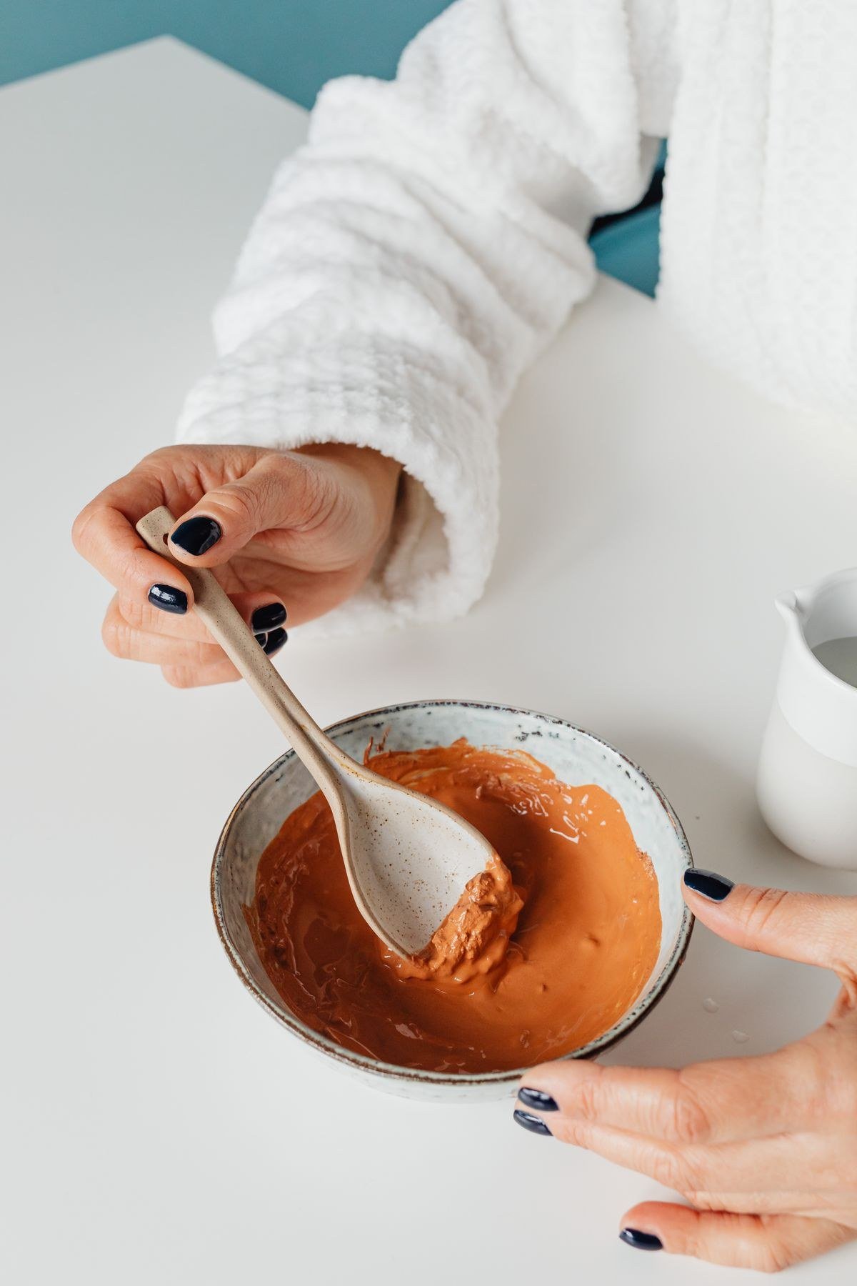 Classic avocado face mask being applied to clean skin