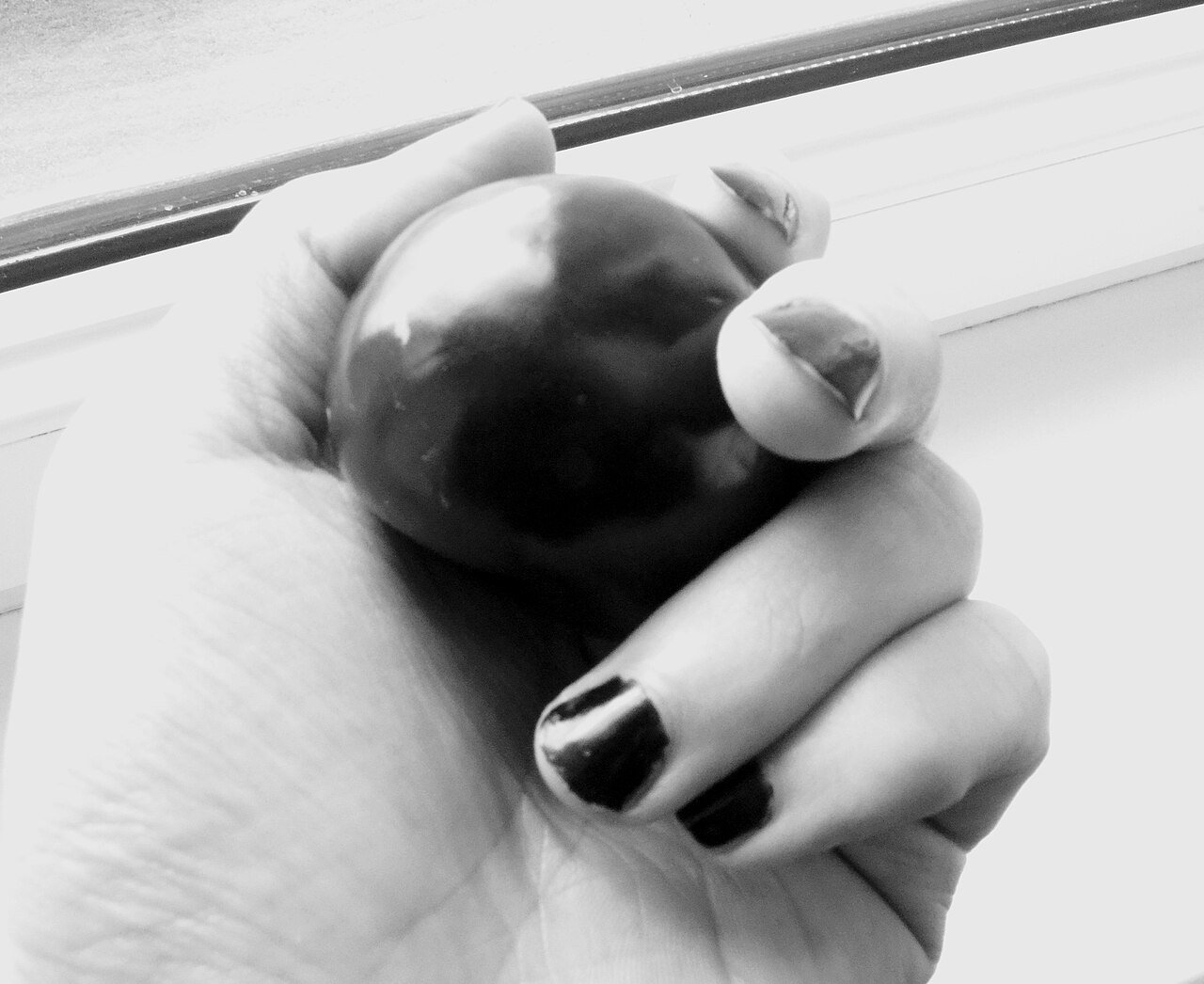 Long black stiletto nails with silver rings for witch look