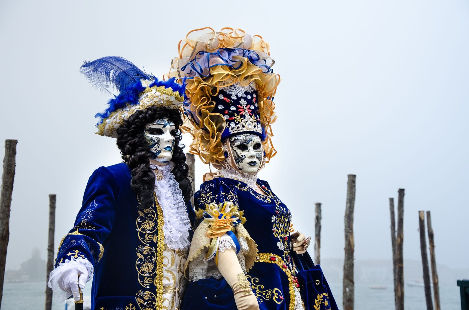 Masquerade masks and carnival props at a Halloween drinks station