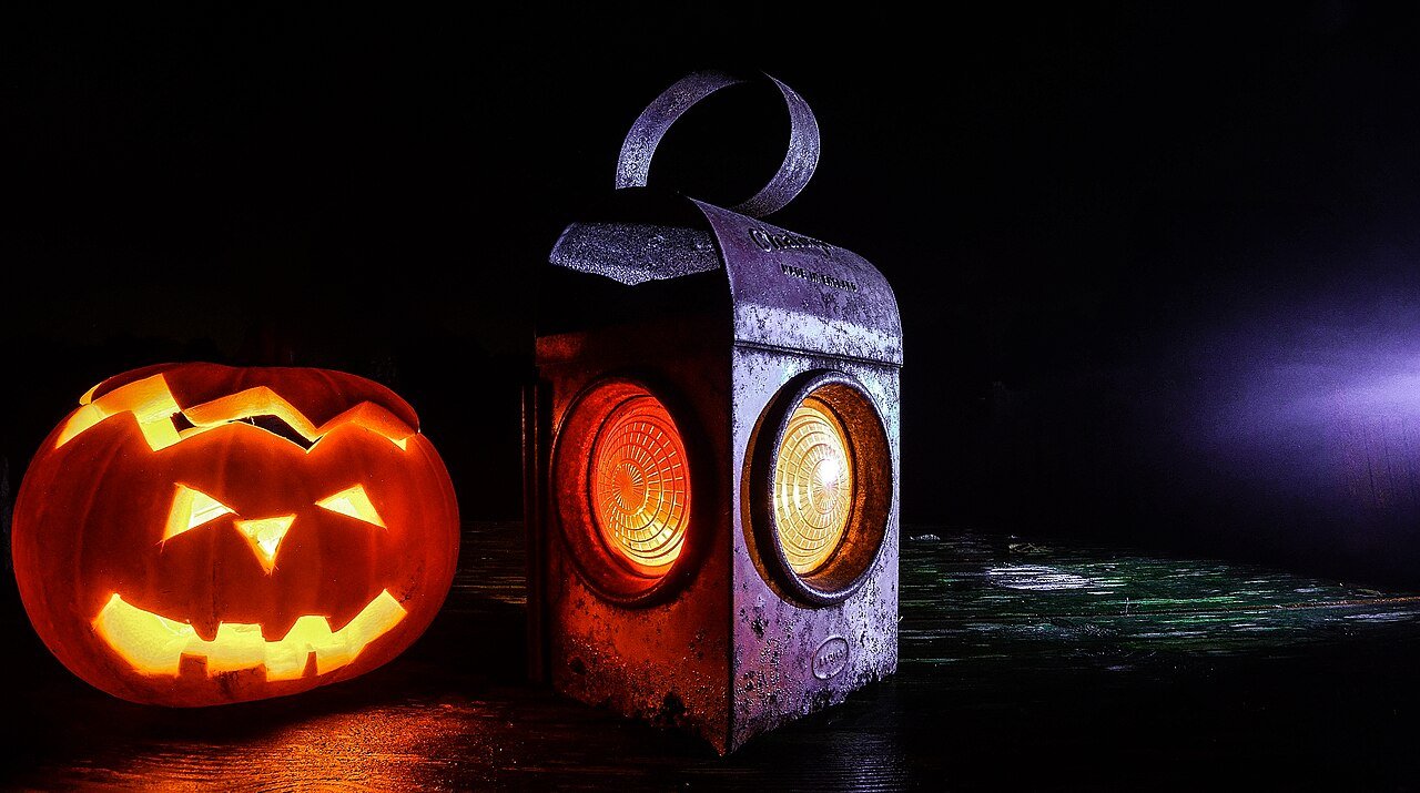 Warm vintage halloween color palette with orange black and cream tones
