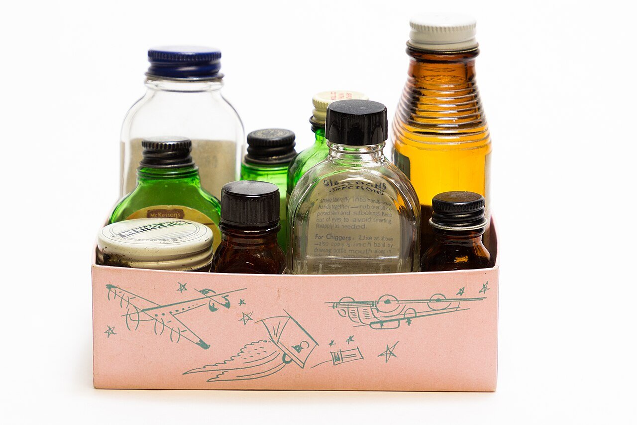 Antique books and vintage potion bottles with handwritten labels