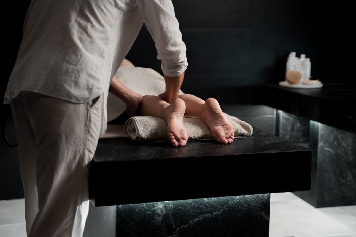Minimal bathroom corner with a tray of body care essentials