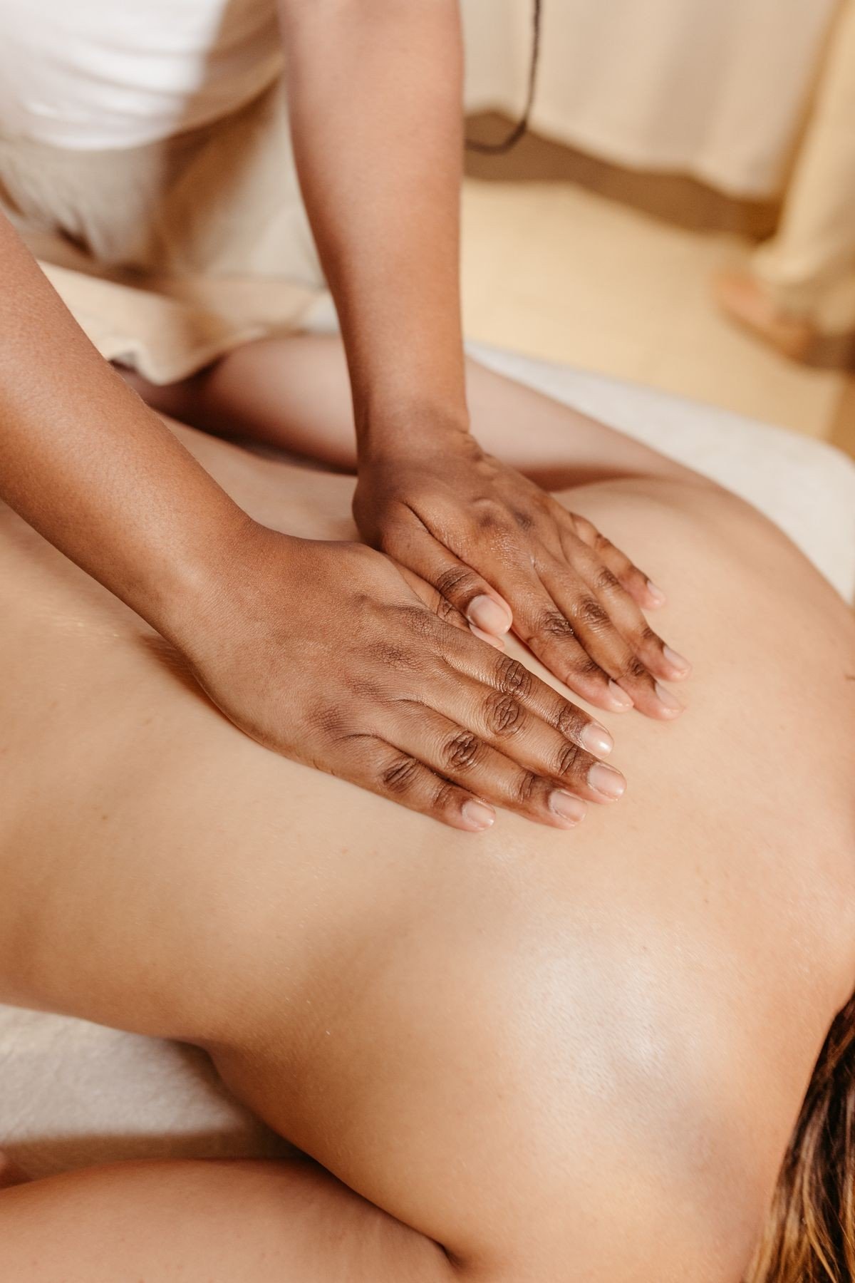 Morning body care routine with light lotion applied to arms