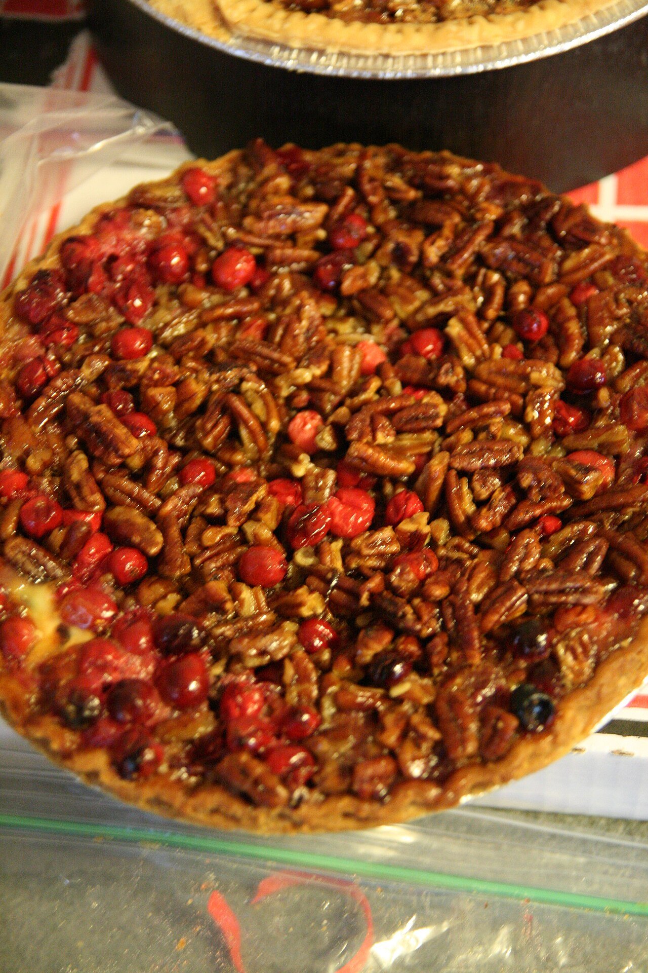 Toasted pecans cooling on a baking sheet after roasting in the oven