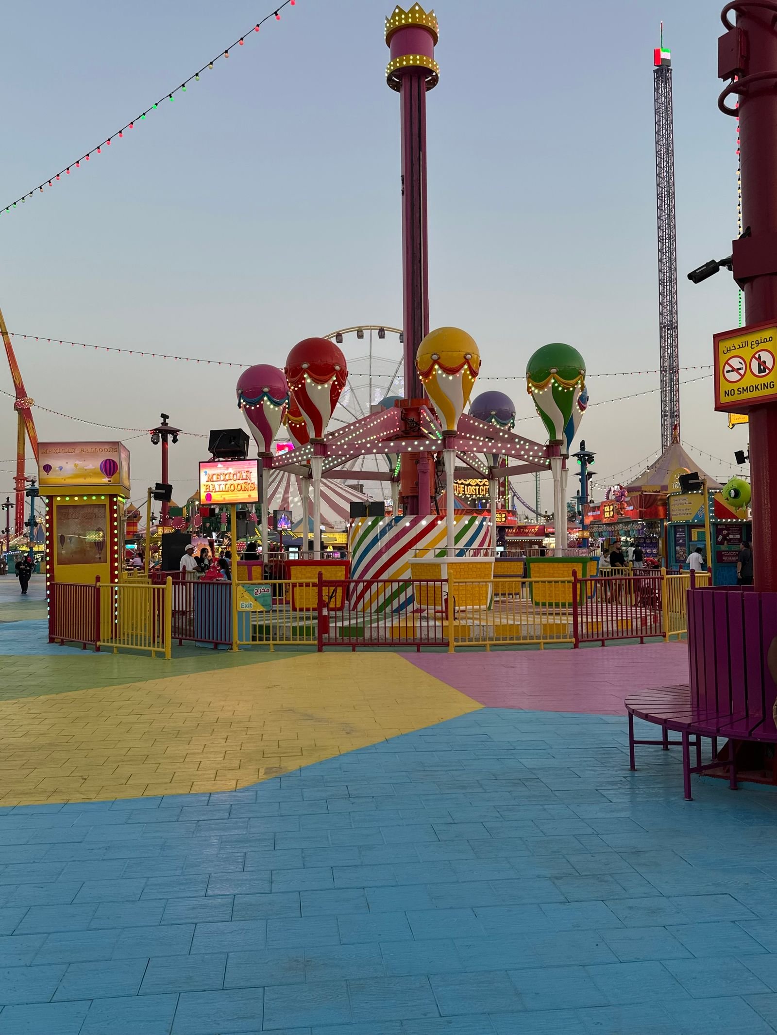 Theme park style dessert display with tiered stands and bright treats