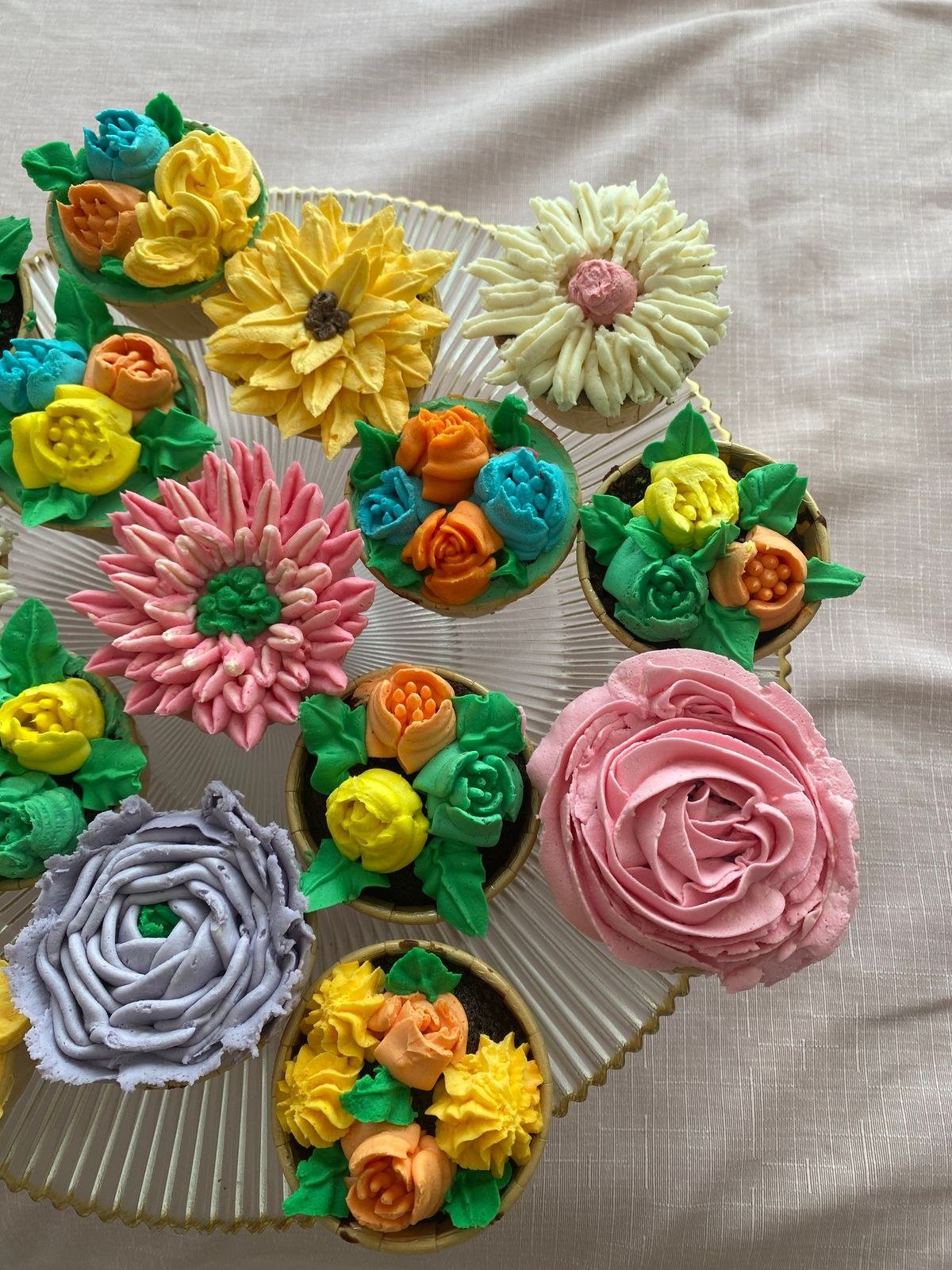 Flower pot cake topped with fresh edible flowers and herbs