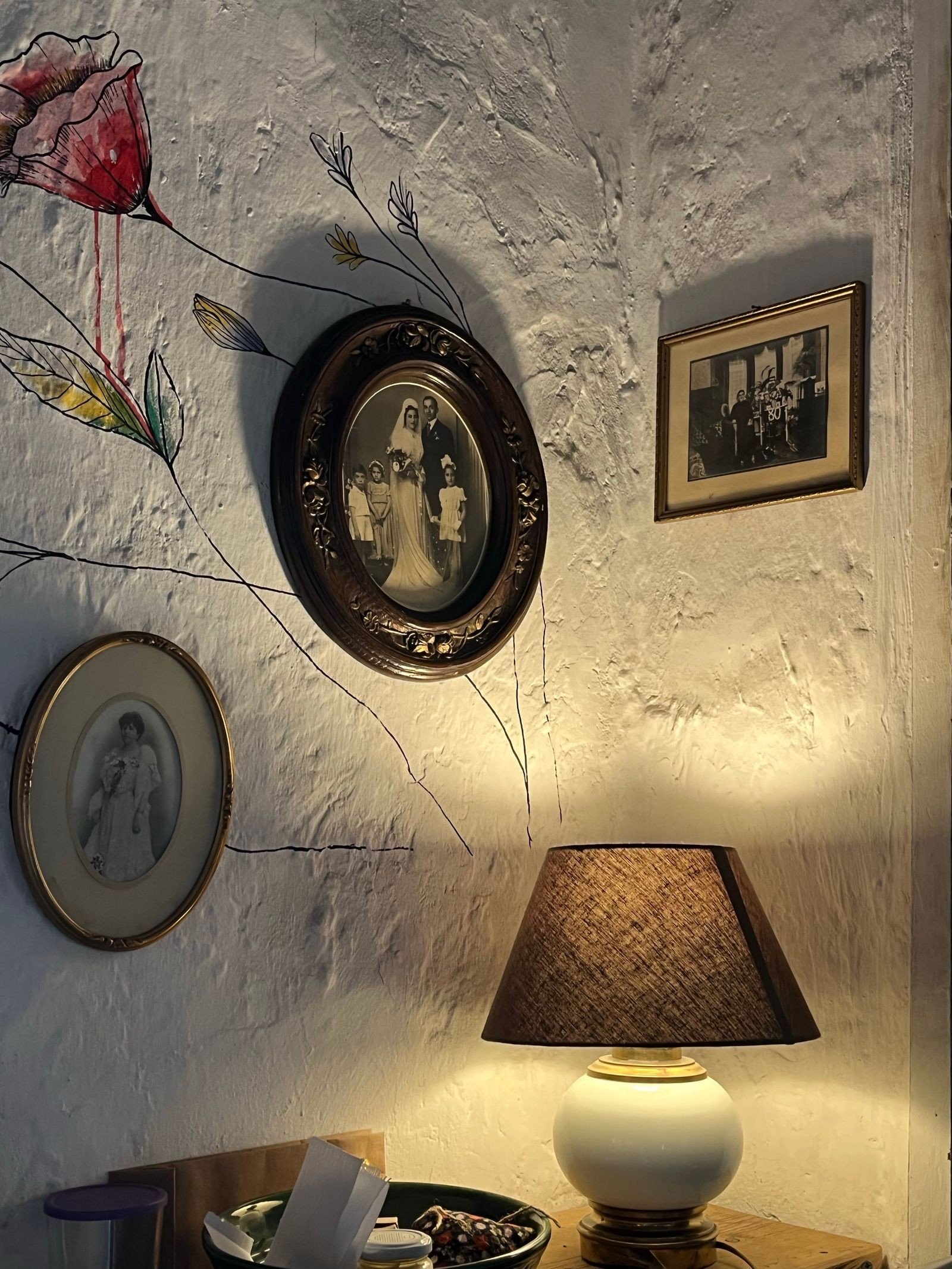 Long hallway gallery wall with framed family pictures