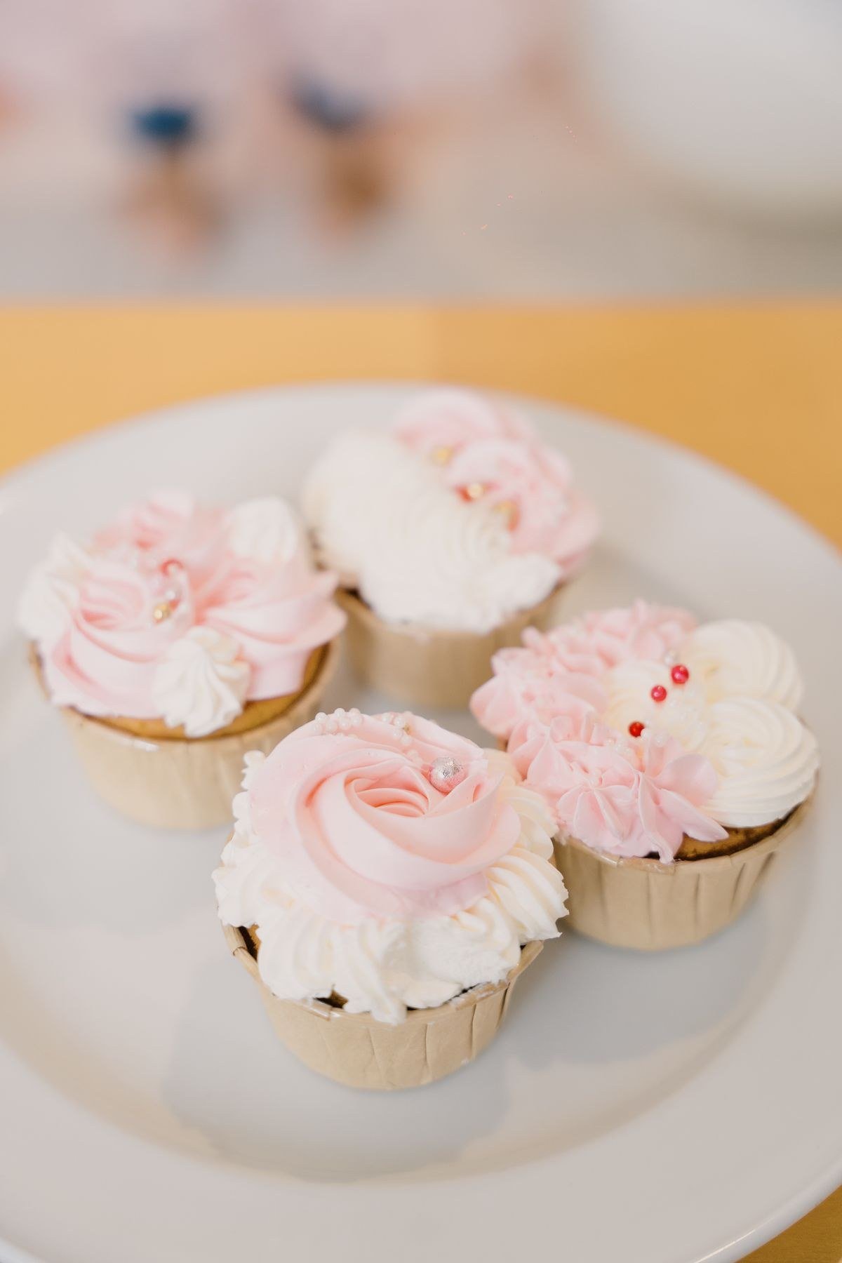 Assorted sizes of flower pot cakes from mini to large showpiece
