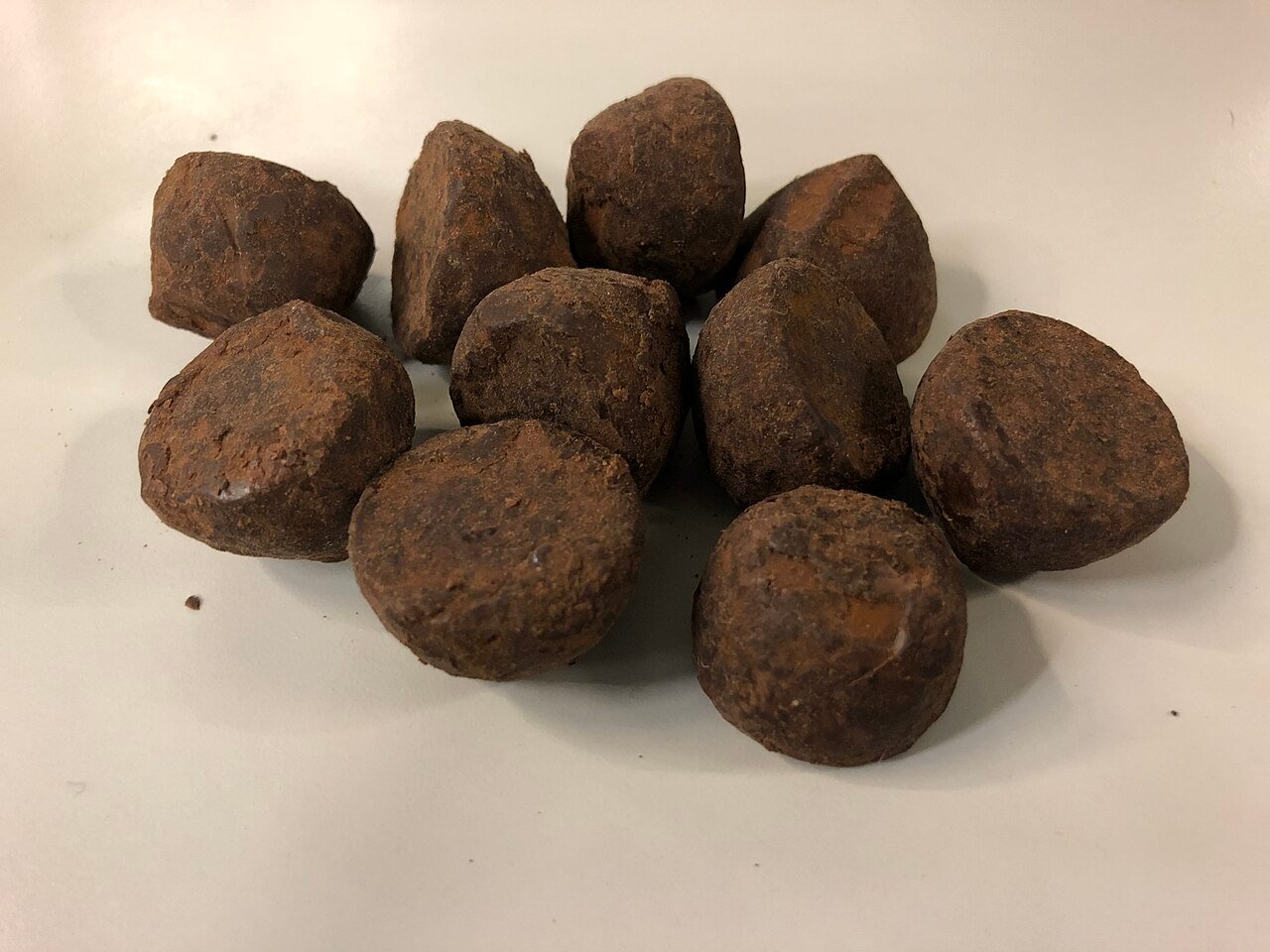 Variations of Butterfinger balls with white chocolate and dark chocolate coatings