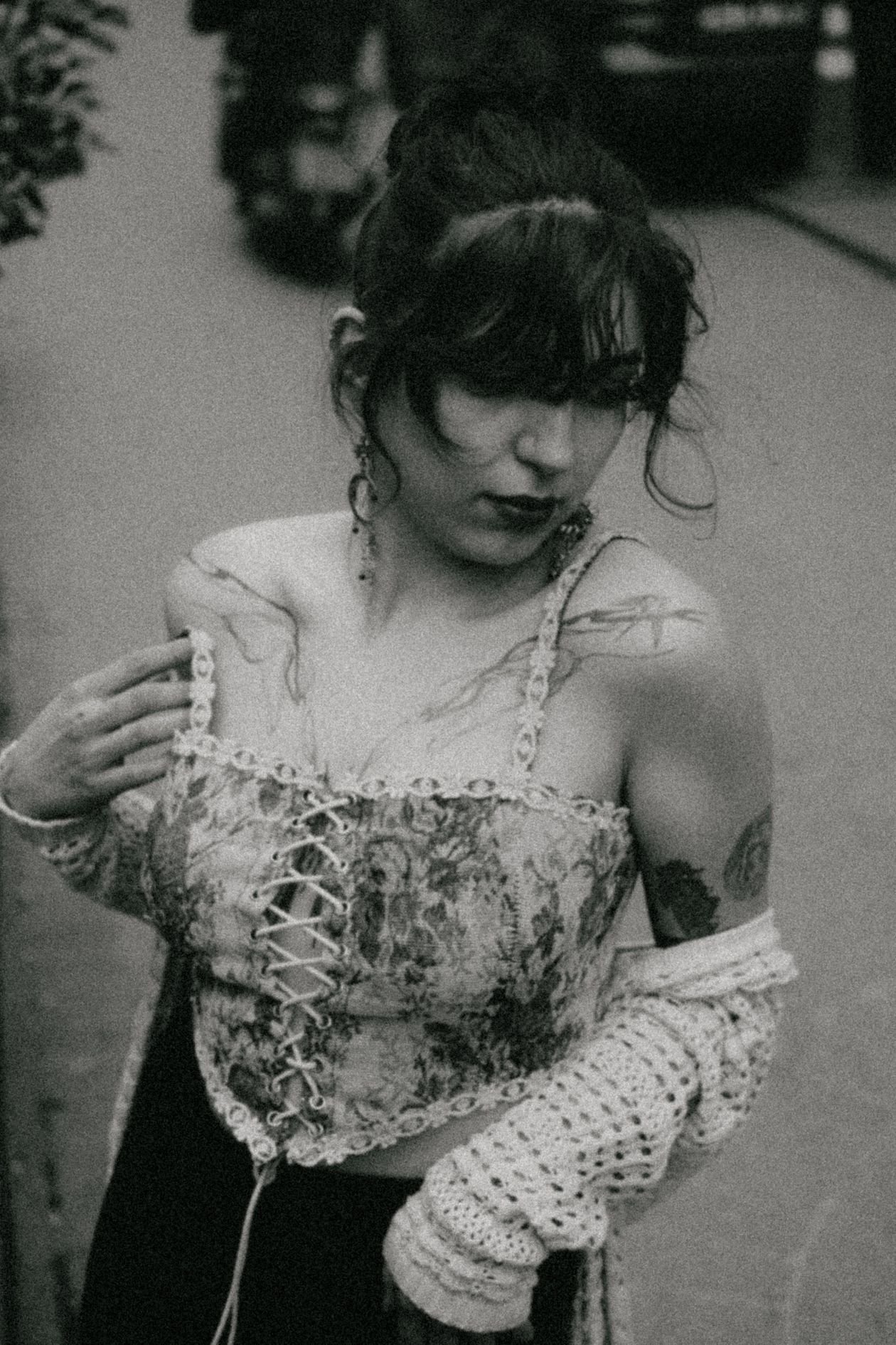 Young woman in a vintage lace-up top
