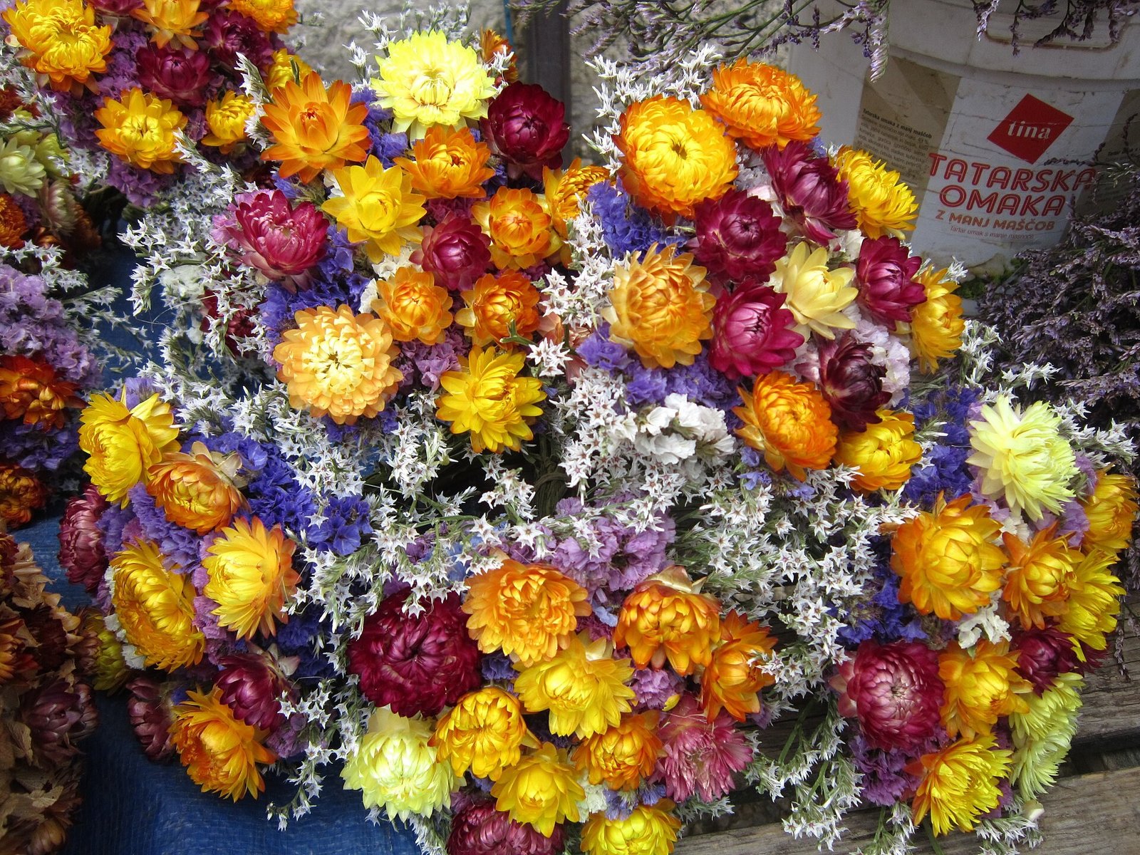 Abundant wild arrangement of mixed dried branches in a large floor vase