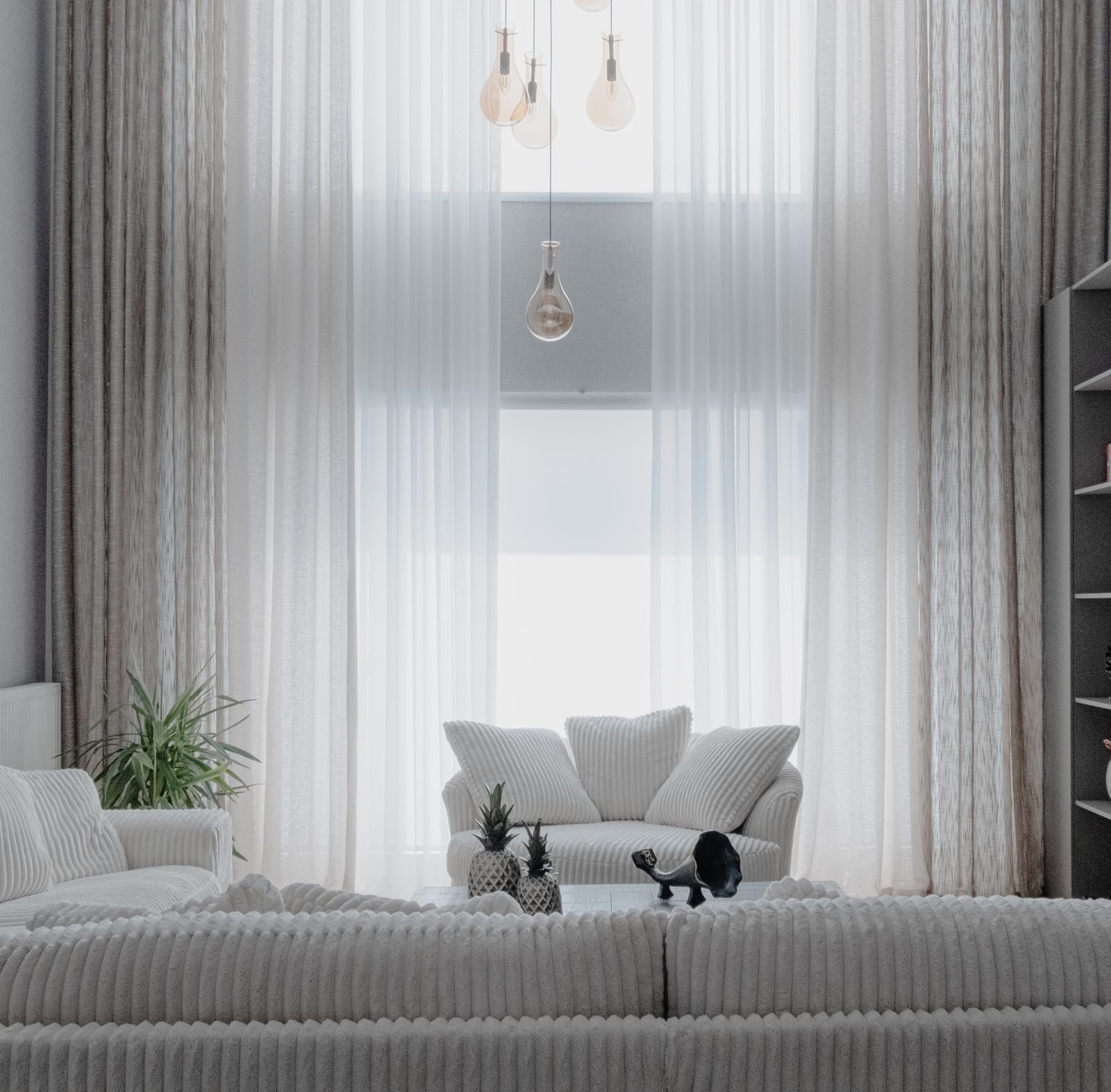 Modern living room featuring marble coffee table and brass accents with sleek finishes