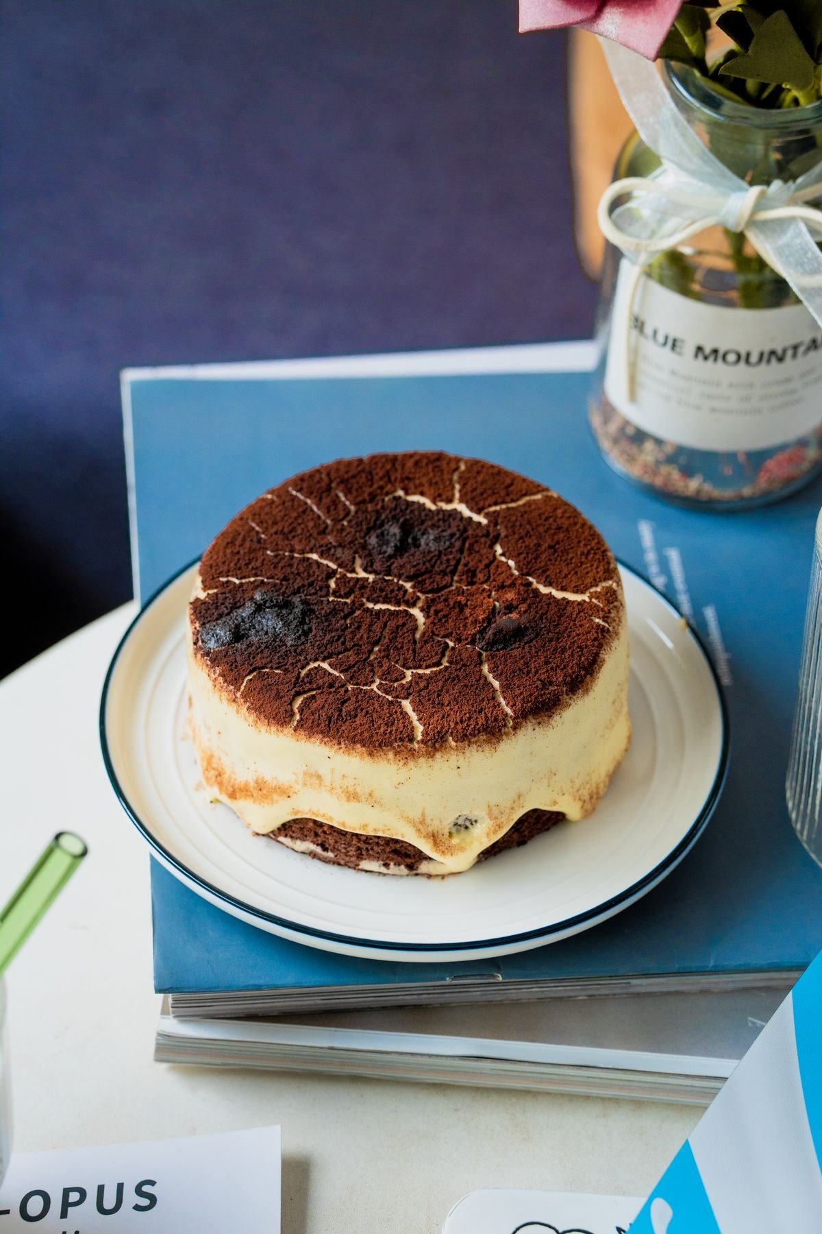 Couple tasting tiramisu wedding cake samples at bakery
