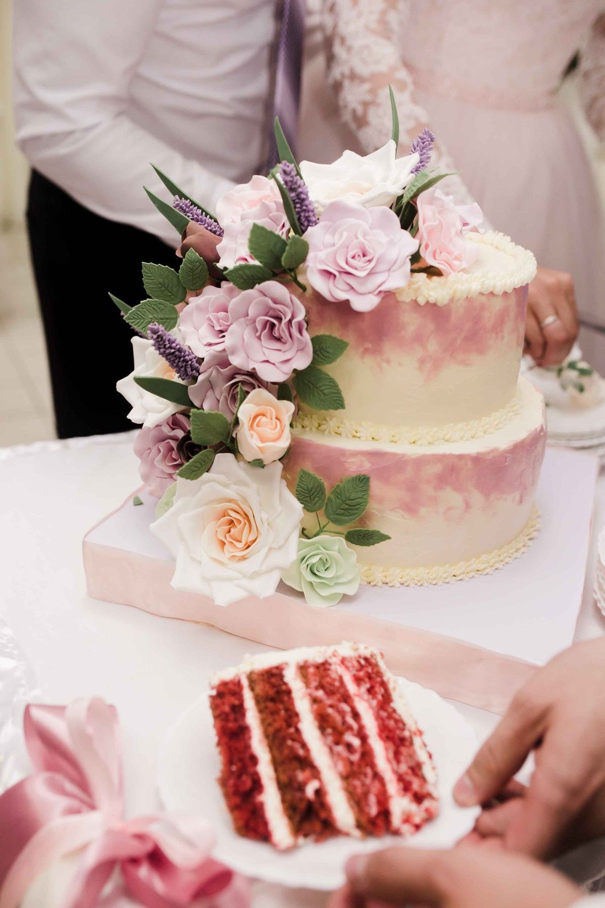 Caterer serving chilled tiramisu wedding cake slices to guests