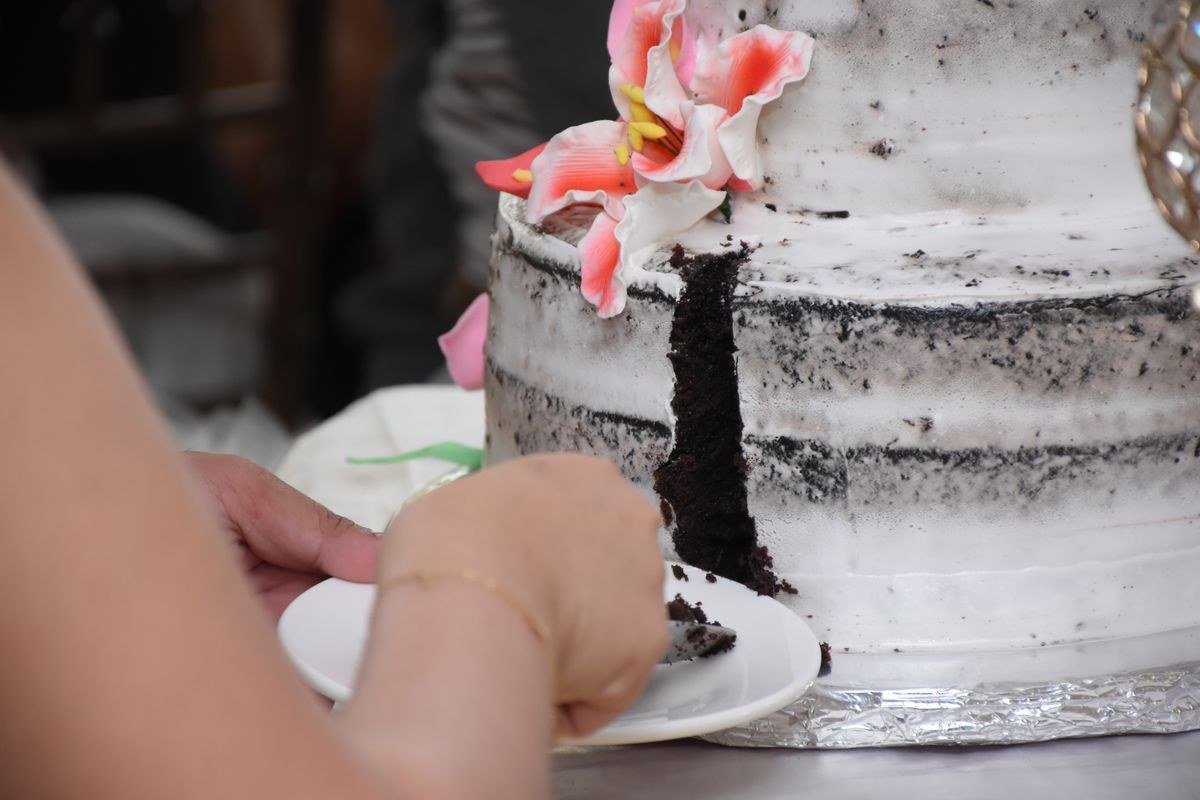 Wedding guests enjoying slices of tiramisu wedding cake
