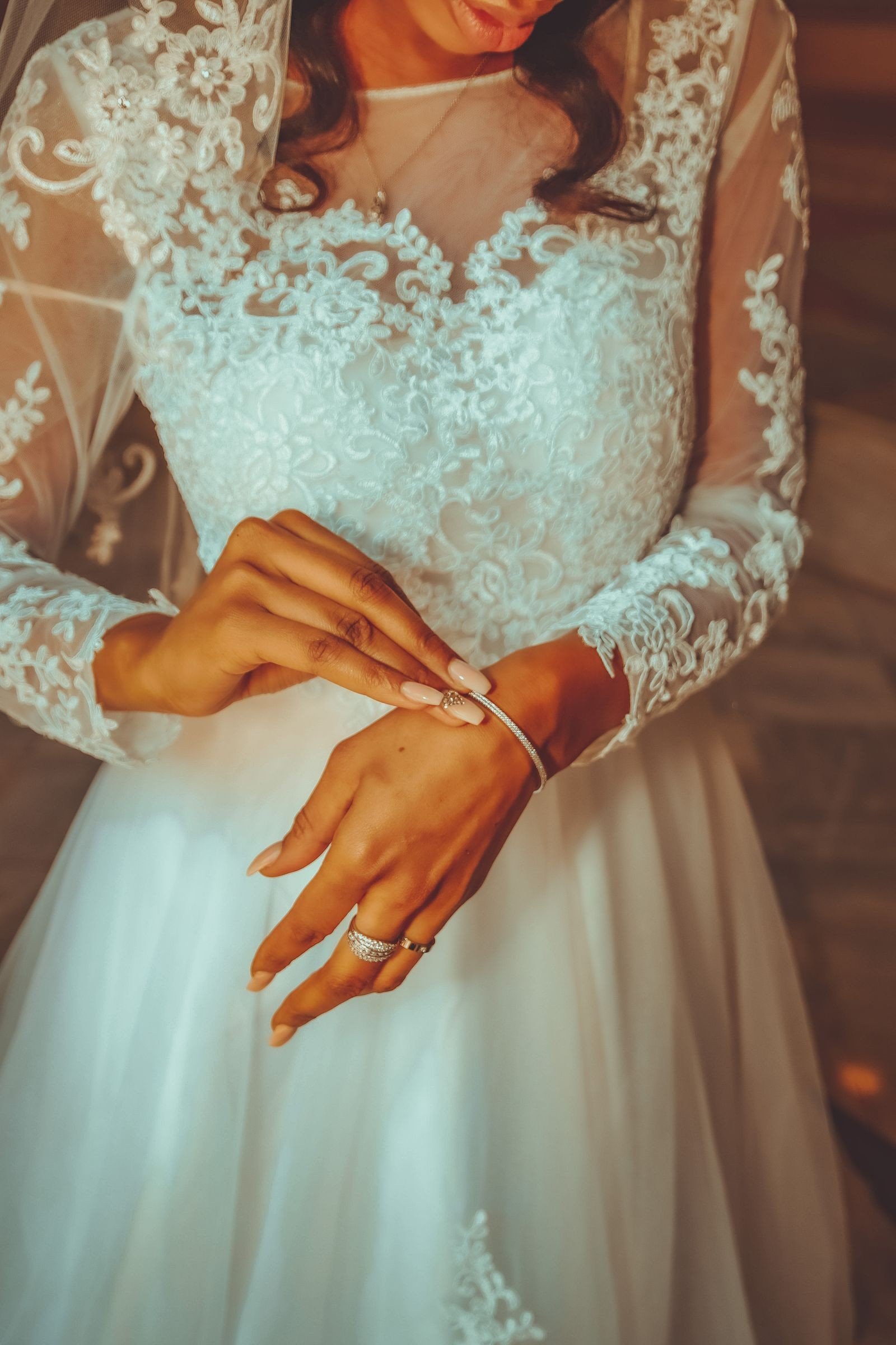 Classic white lace nails over a nude polish base
