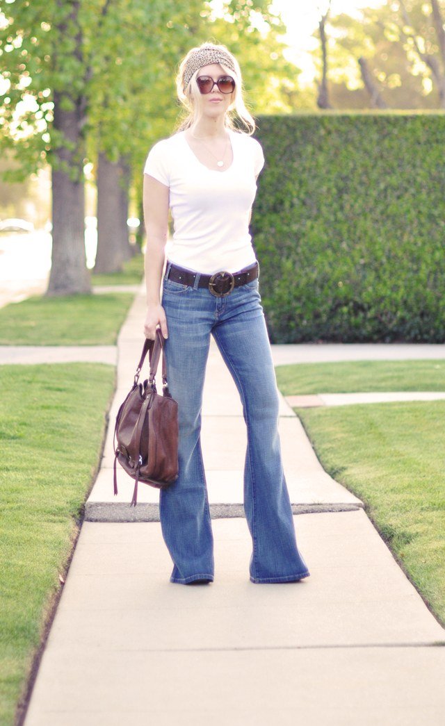 Oversized camel blazer layered over barrel leg jeans for fall