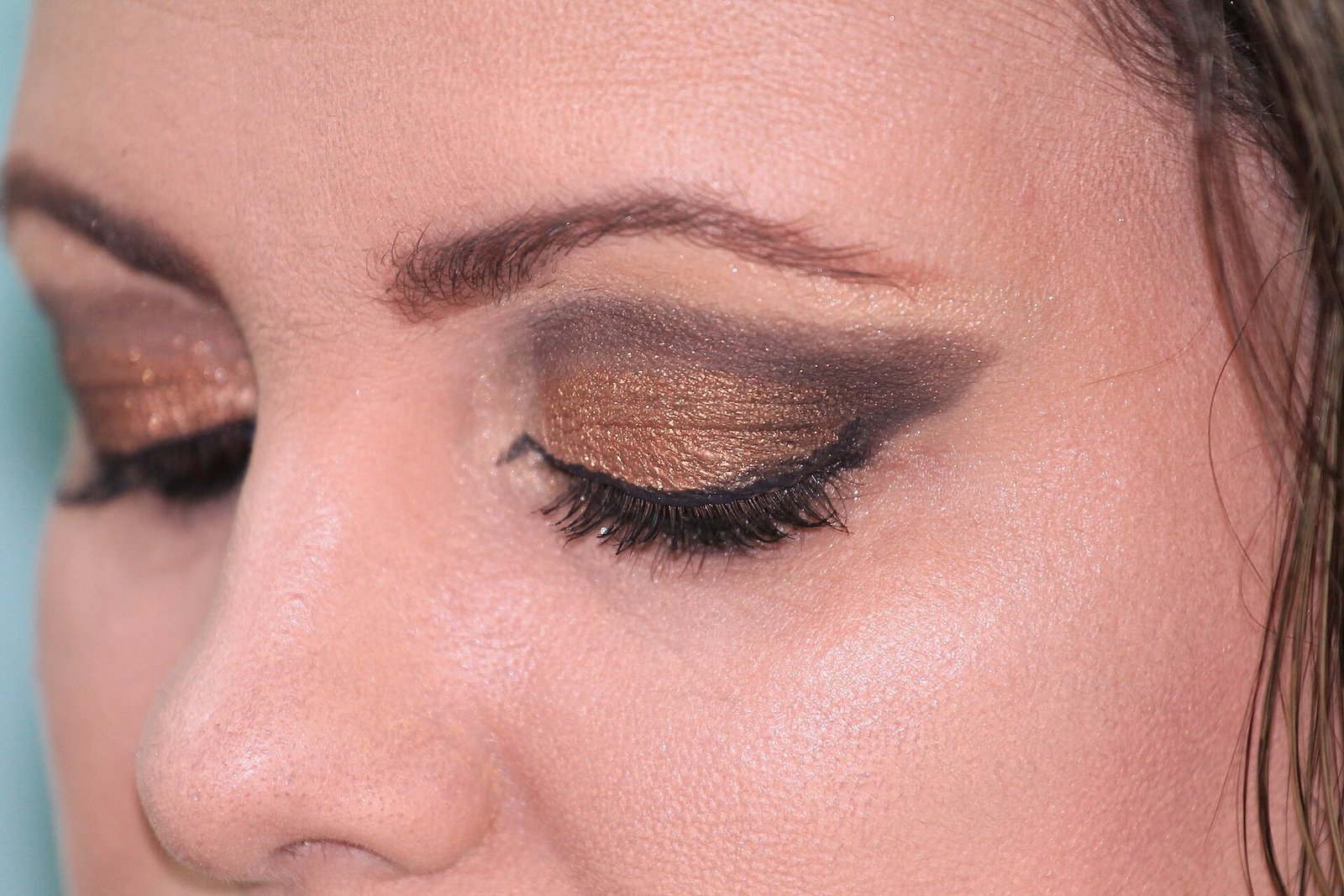 Silver eyeliner on the lower lash line brightening eyes