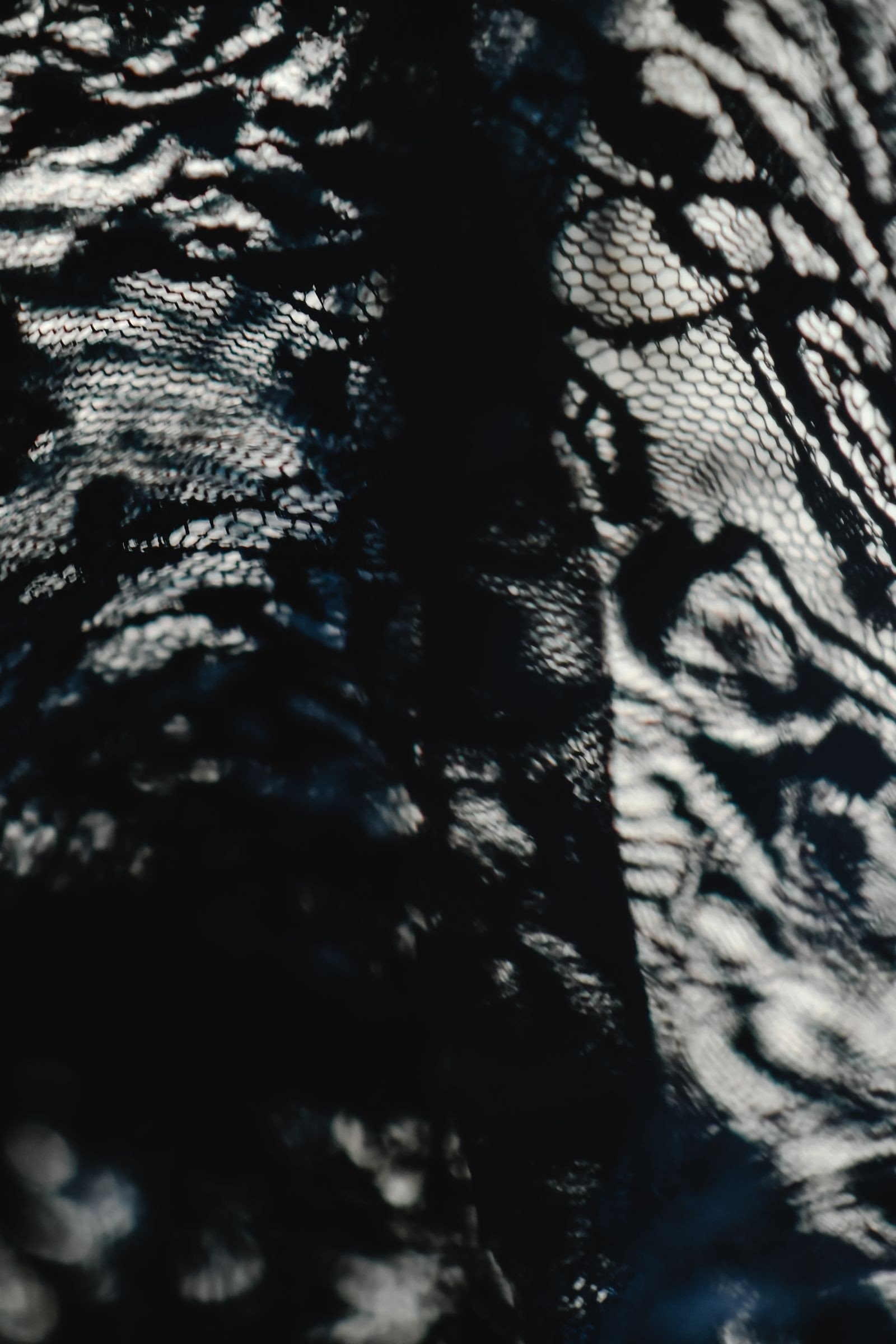 Hand painting fine lace details with a detail brush